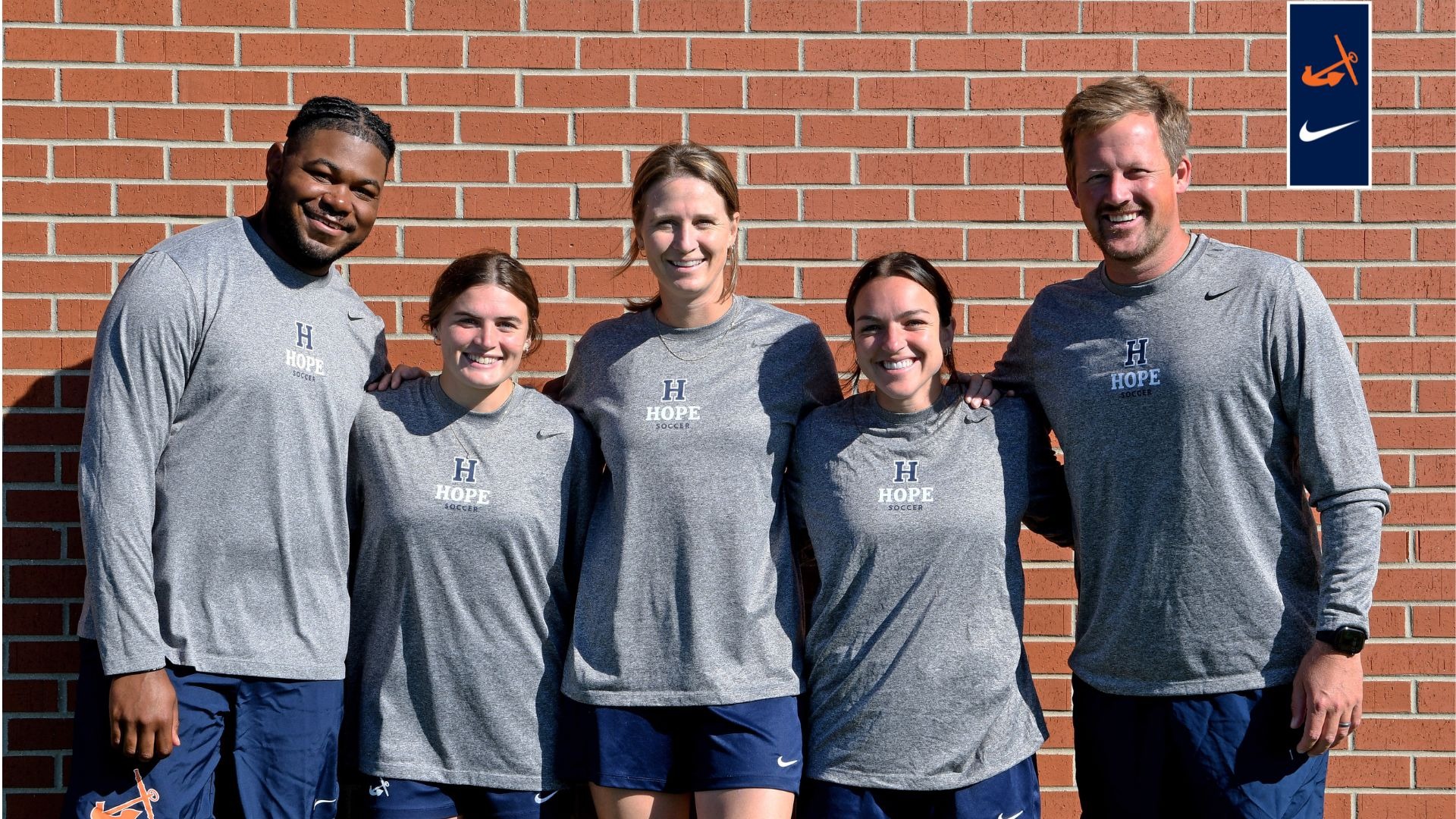 Five Hope College women's soccer coaches pose for portrait.