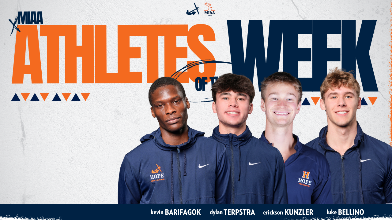 Four men's track runners pose for portraits.