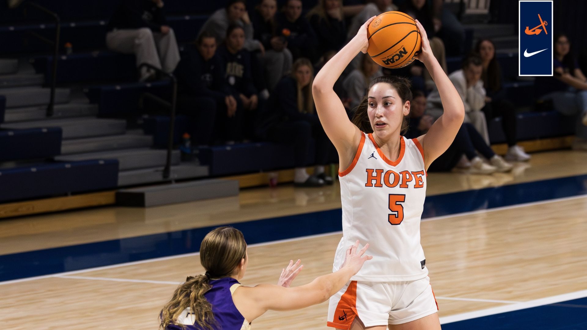 Center Katie Blazei looks to make a pass in the post vs. Albion