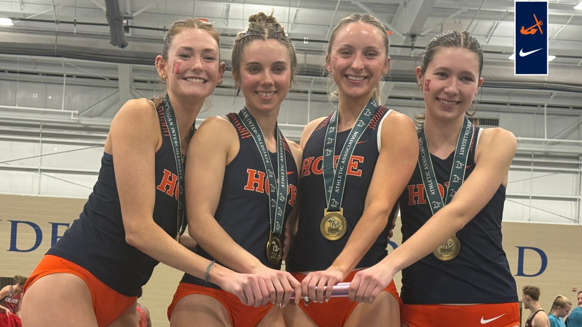 Four Hope women's track sprinters pose on the medal stand.