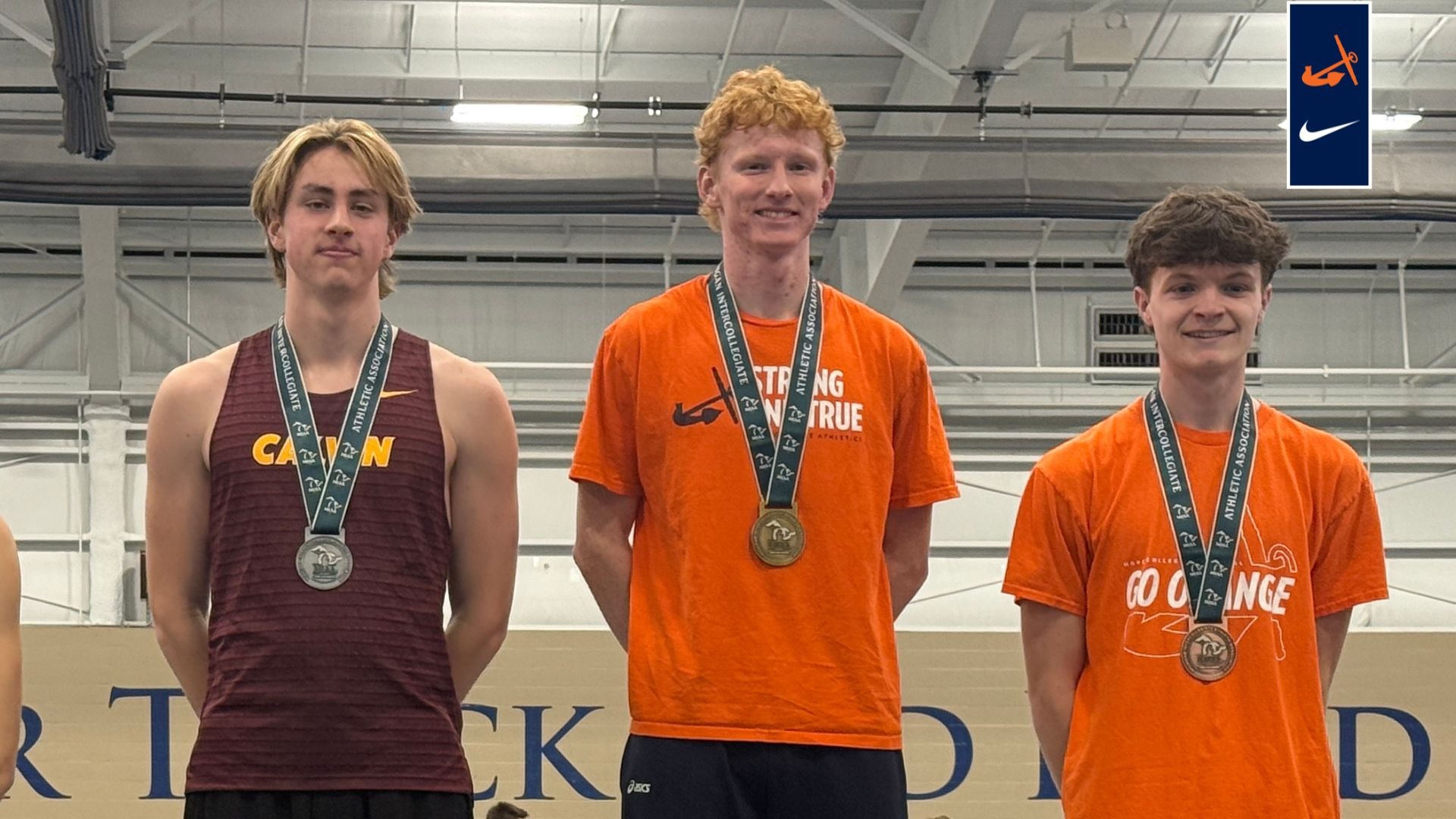 Two Hope men's mile runners stand on the MIAA podium.