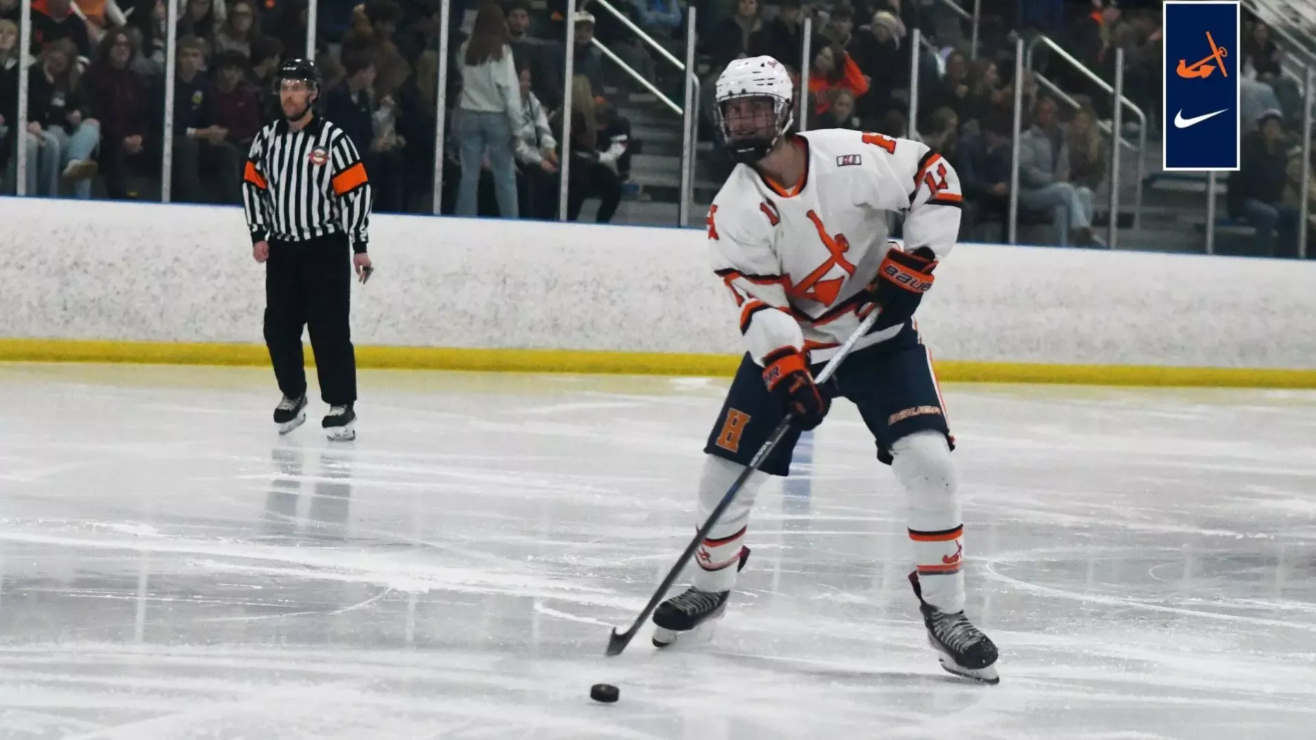 Trevor Davis looks up the ice with the puck.