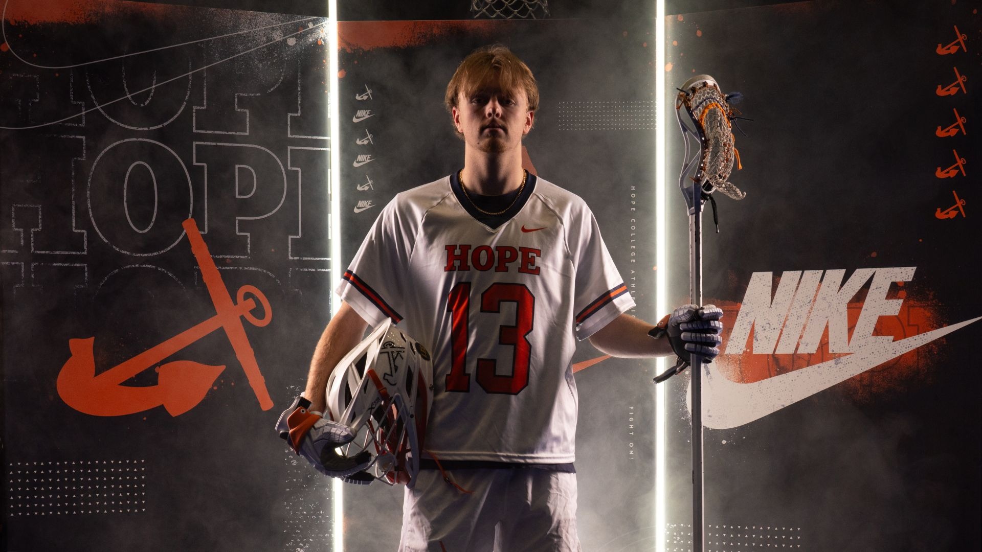 Tyler Berens holds a lacrosse stick.