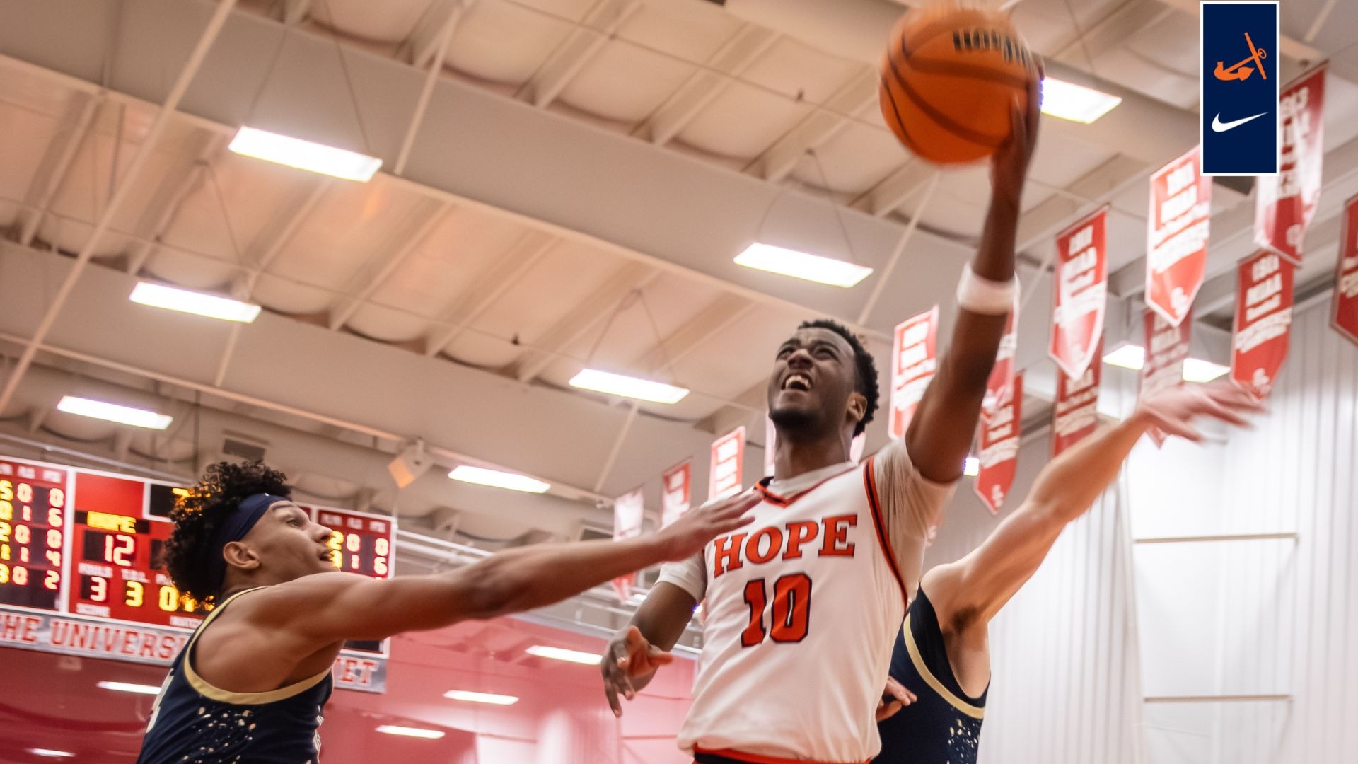 Justice Mims drives to the basket for a left-handed layup.
