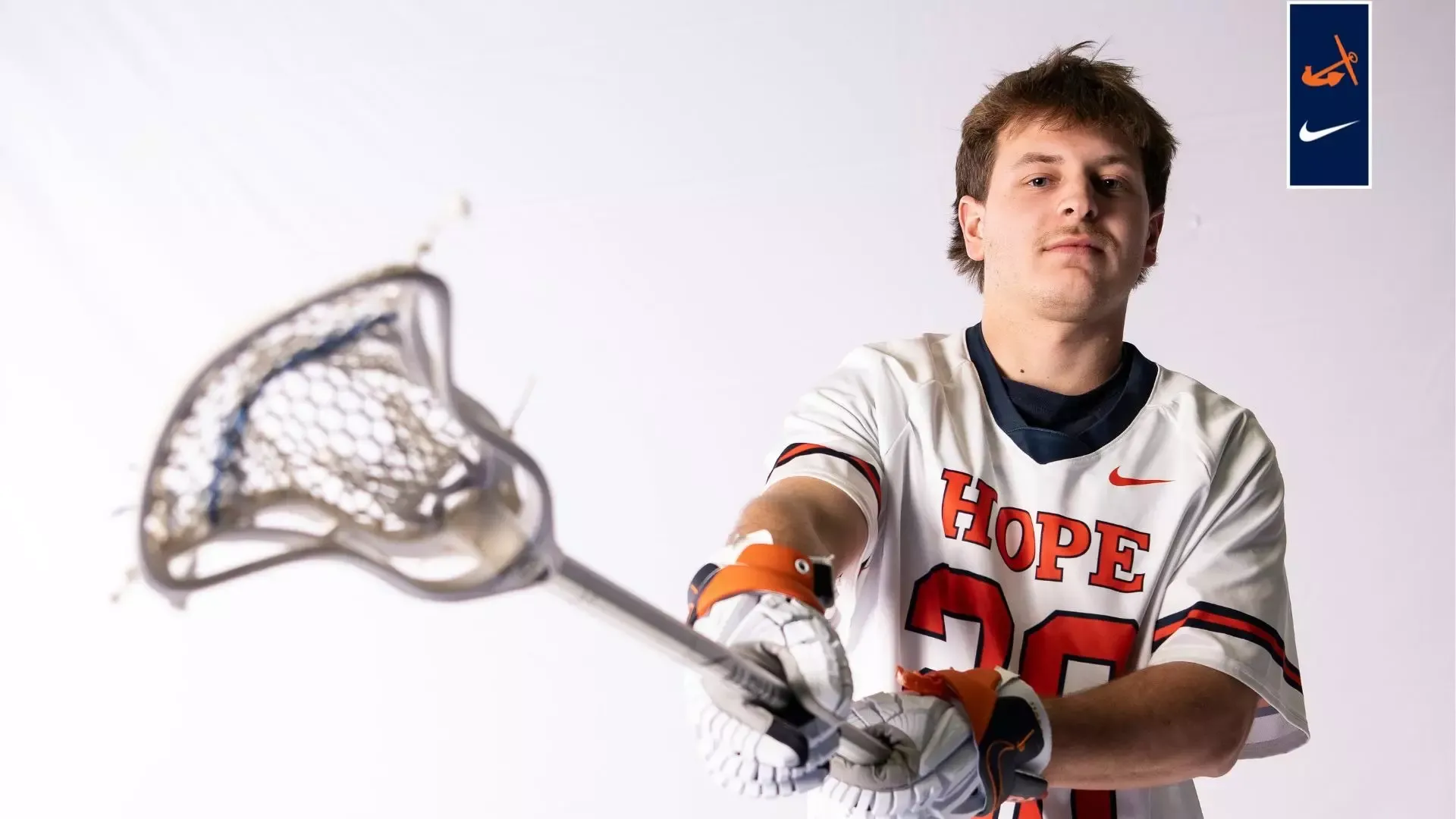 Preston Hoexum holds a lacrosse stick.