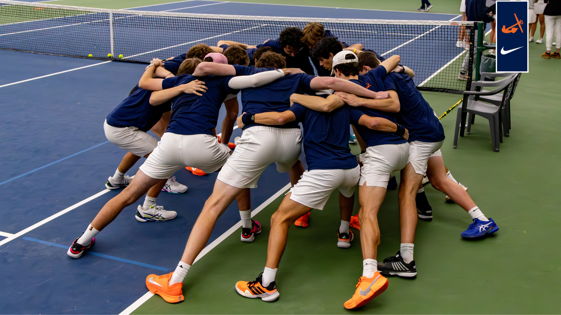 The men's tennis team huddles up before a match