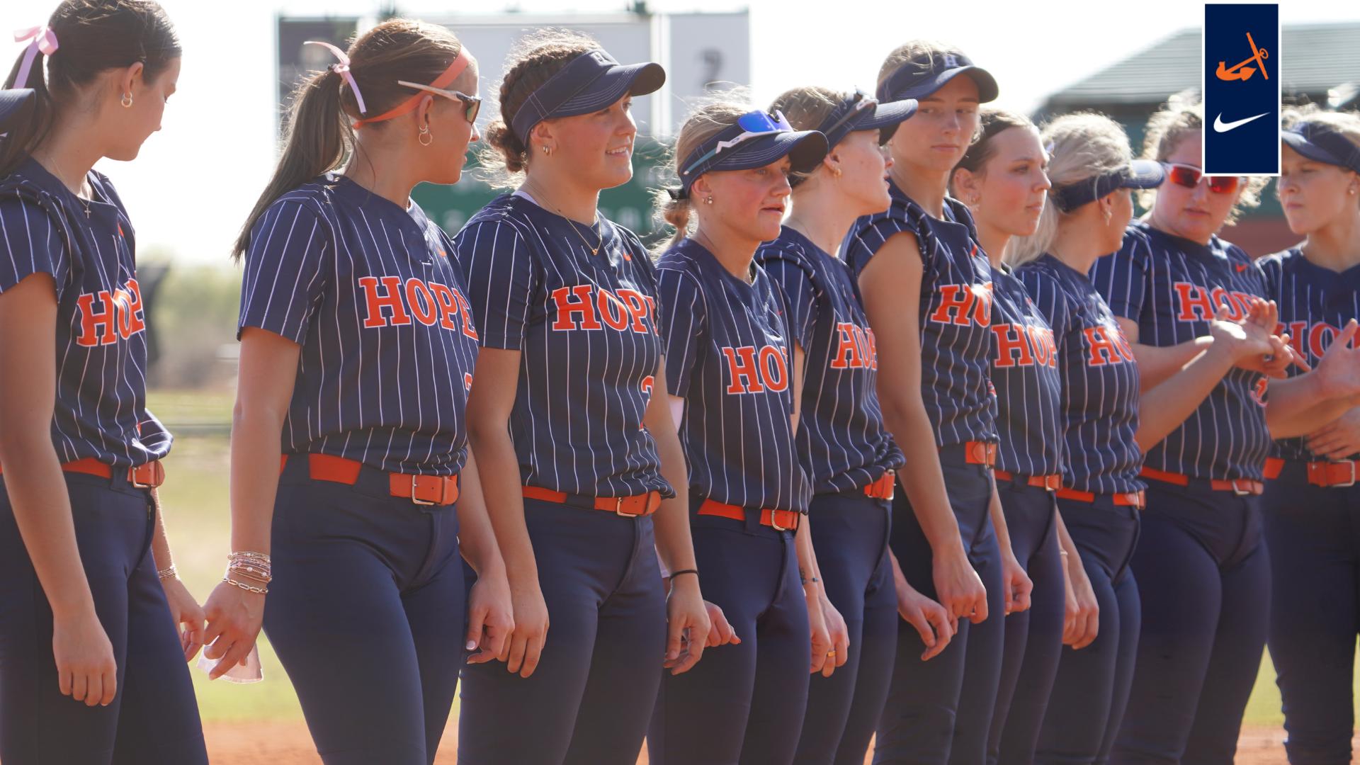 The Hope College Softball team stands together before the game