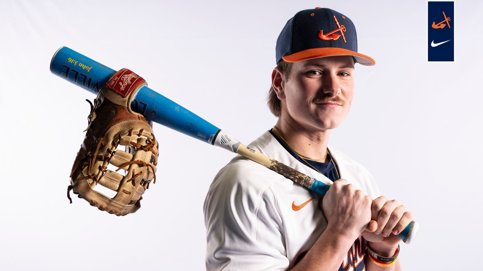 Cade Seabaugh holds a baseball bat on his right shoulder.