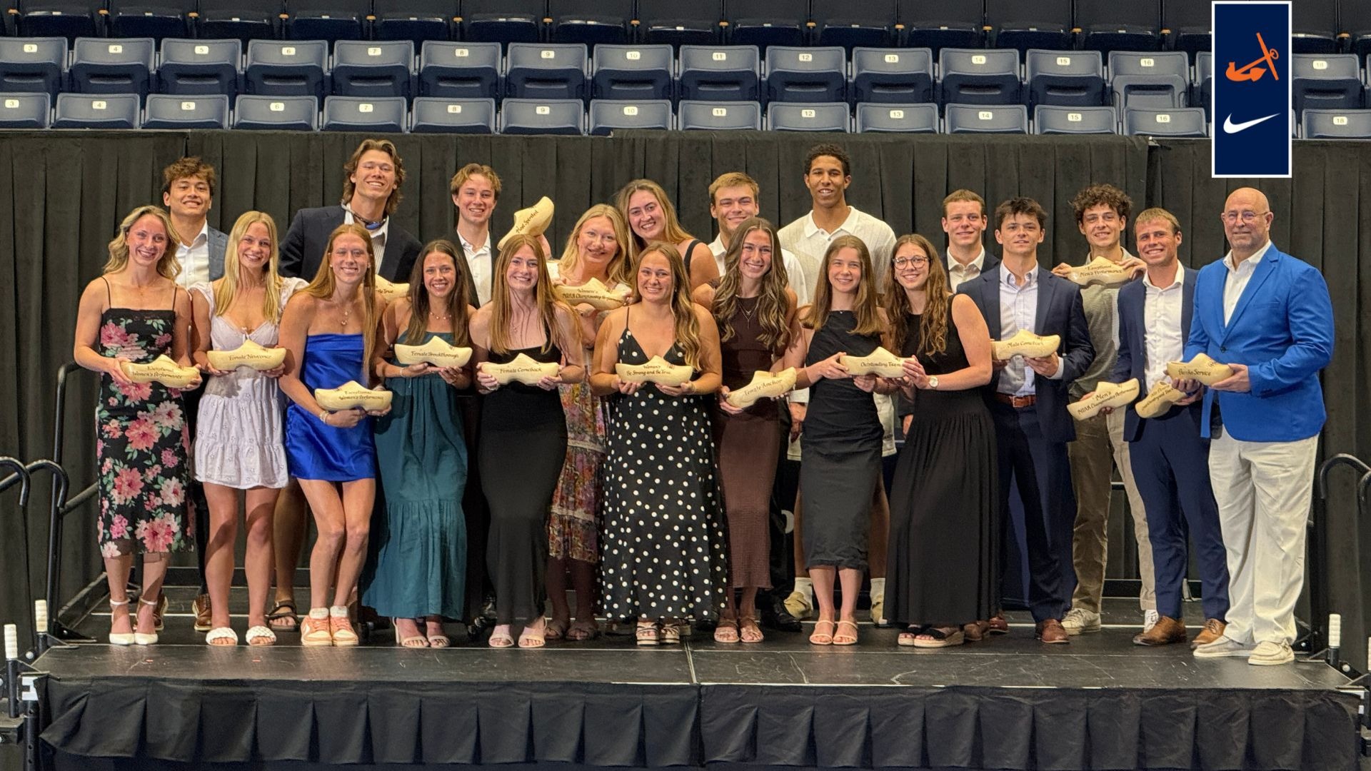 25-26 HOPEYs winners stand together on a stage.