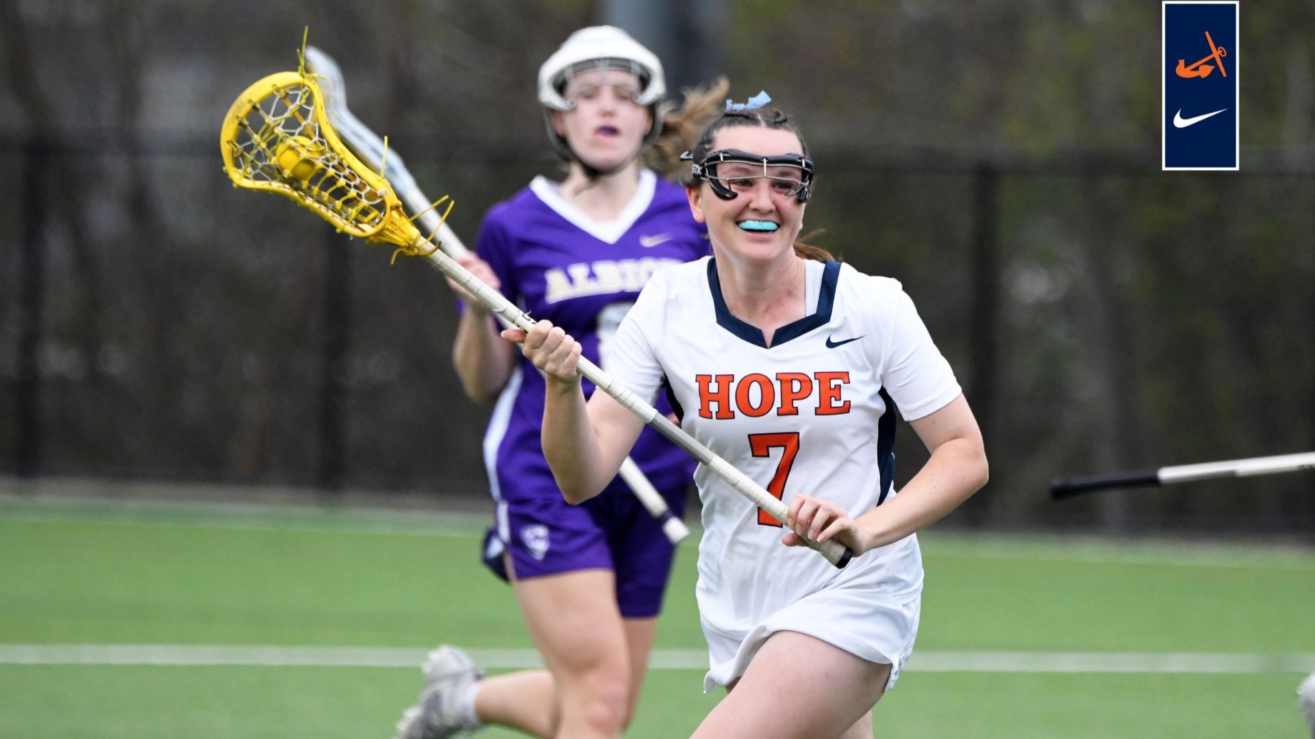Caroline Curnutt carries the ball up field vs. Albion.