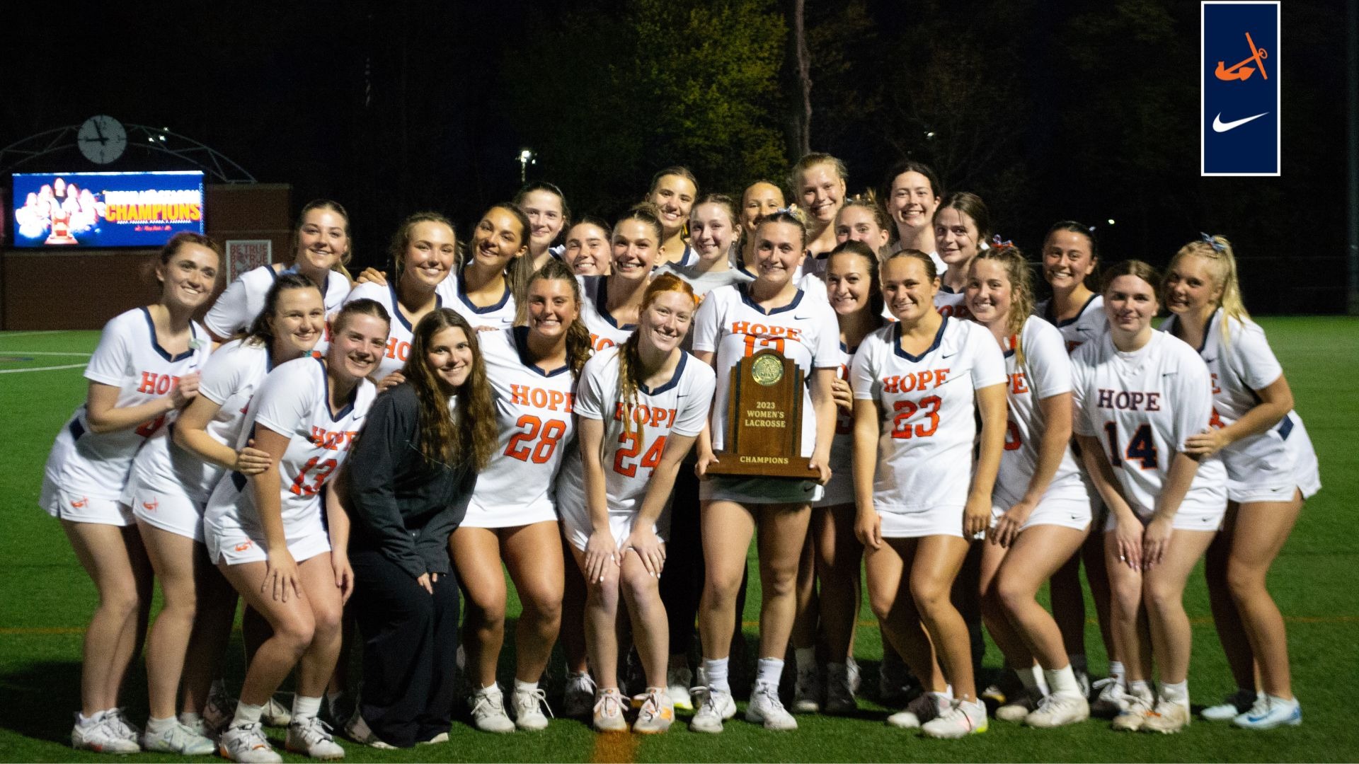 The MIAA co-champion Hope College women's lacrosse team poses for a group photo on the field at Van Andel Stadium.