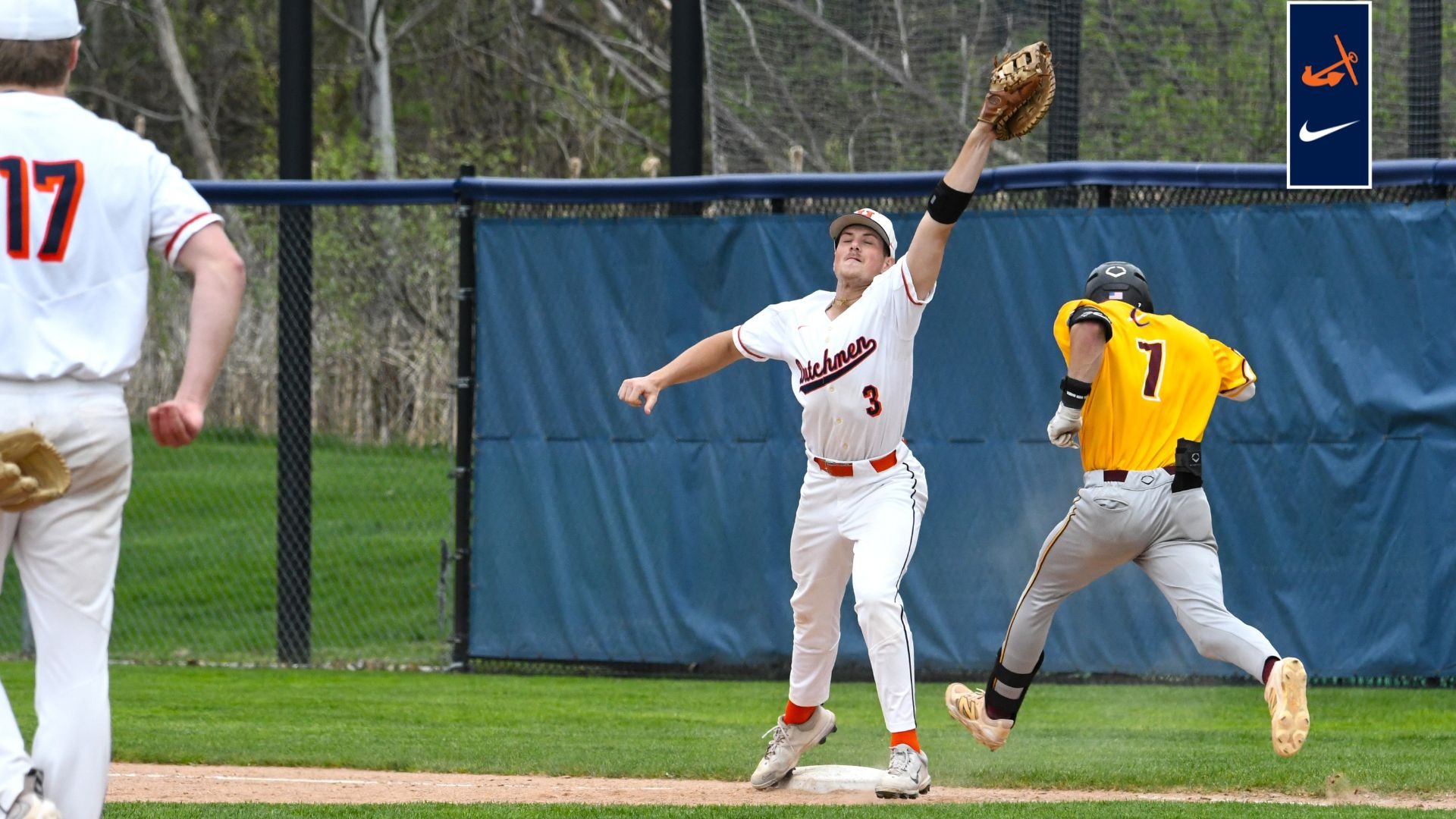 First baseman Cade Seabaugh stretches at first base for a throw to record an out vs. Calvin.
