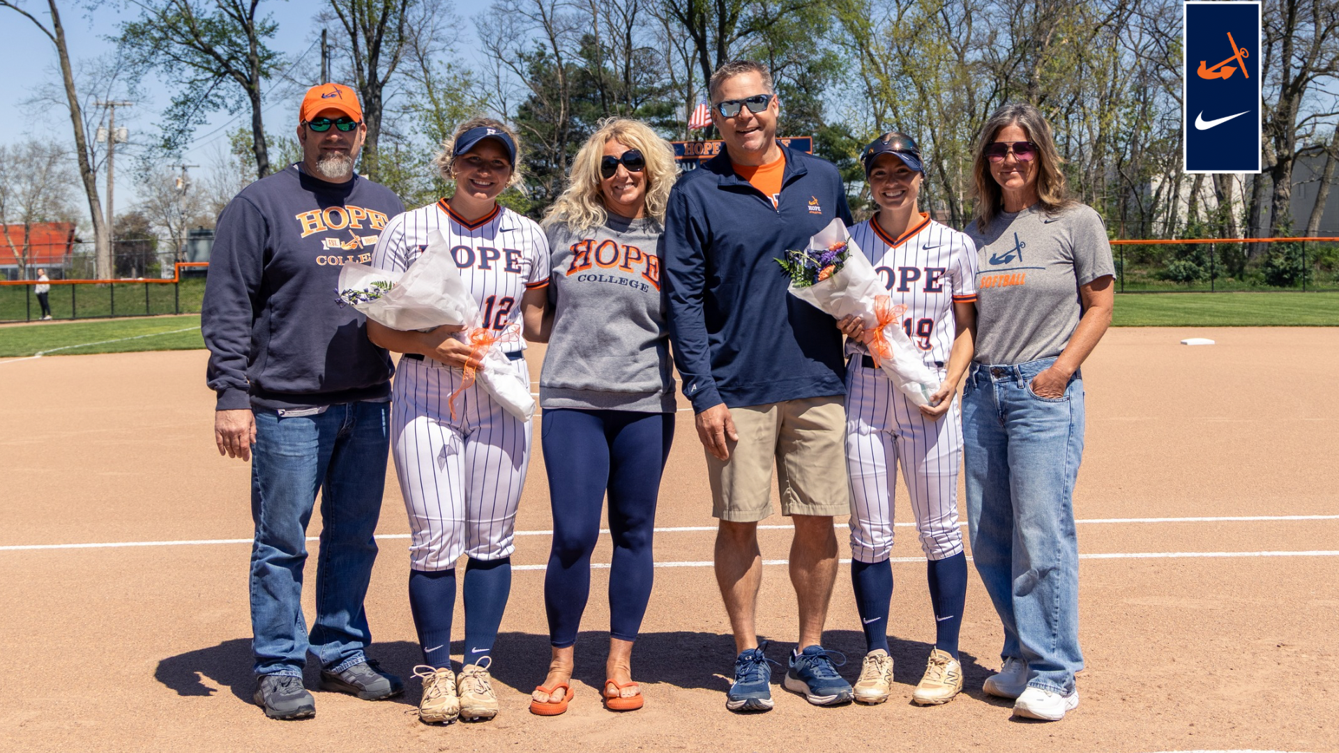 Hope softball seniors and parents pose for a portrait