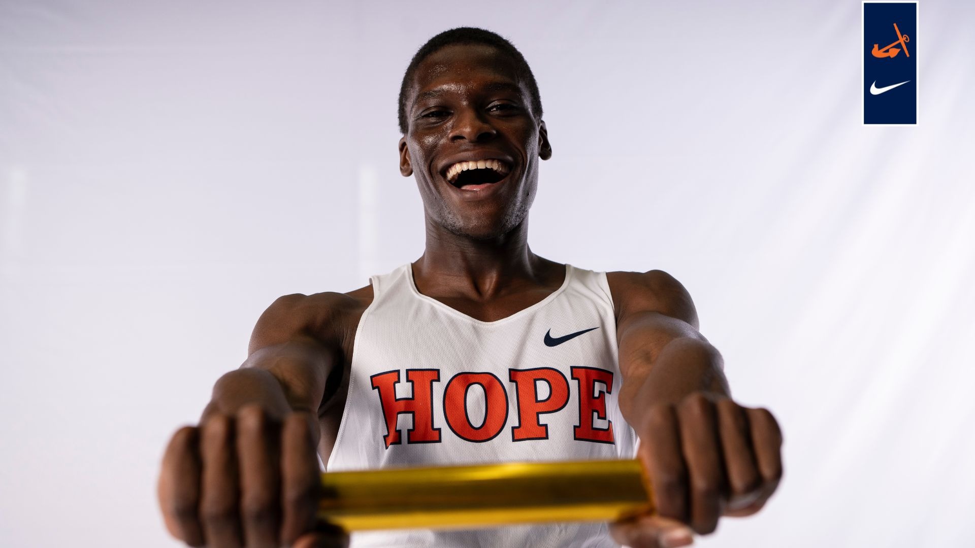 Runner Kevin Barifagok holds a relay baton.