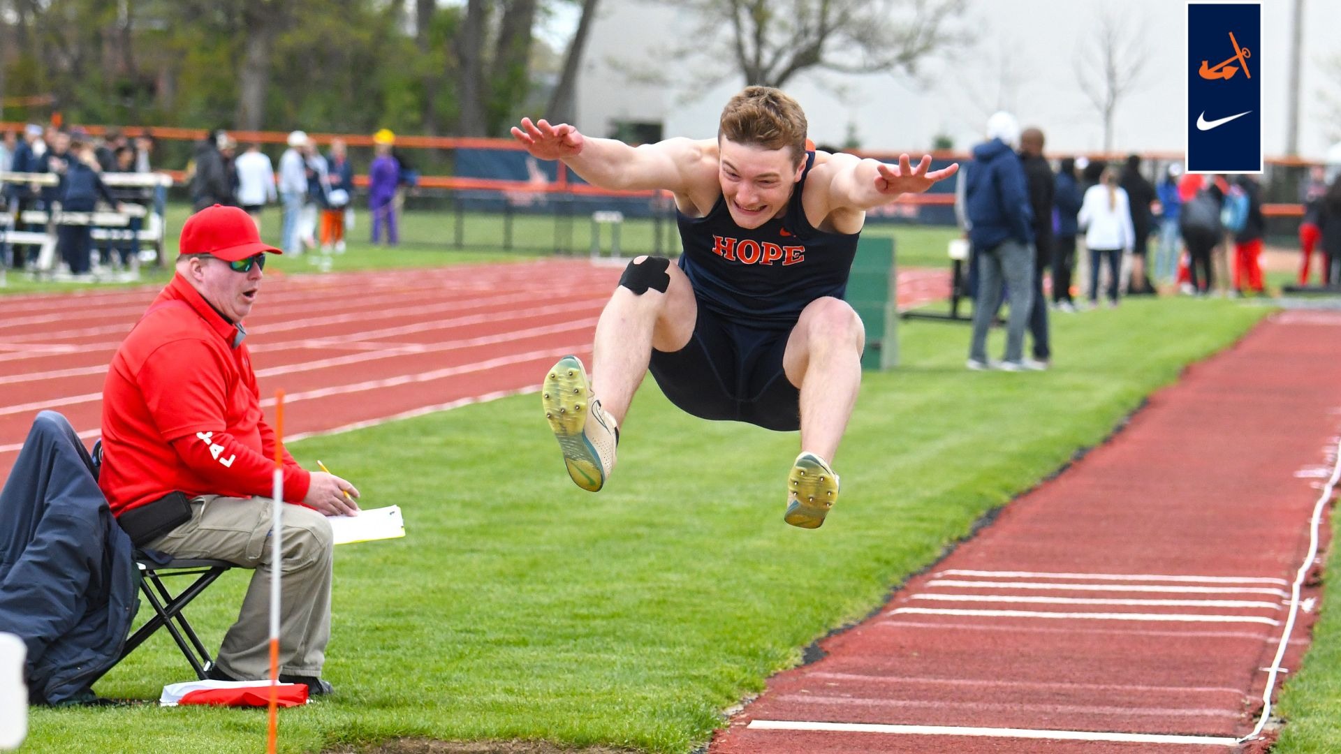 Henry Burnham leaps in the long jump.