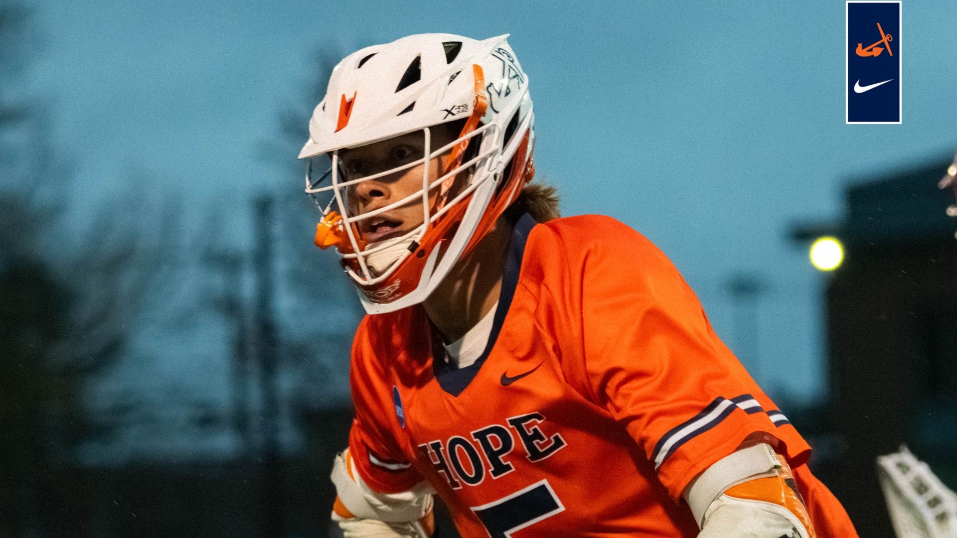 Jack McNamara runs up the lacrosse field against Bates.