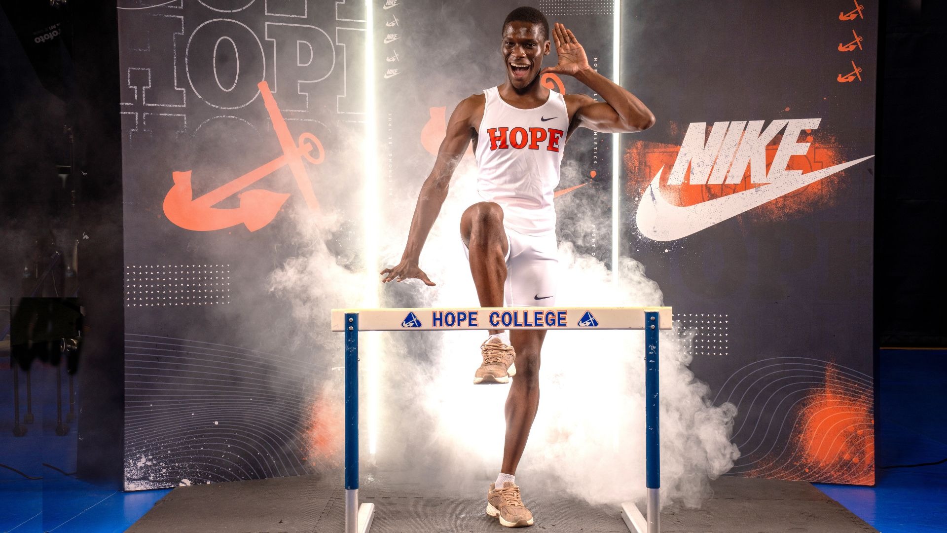 Kevin Barifagok stands in front of a hurdle.
