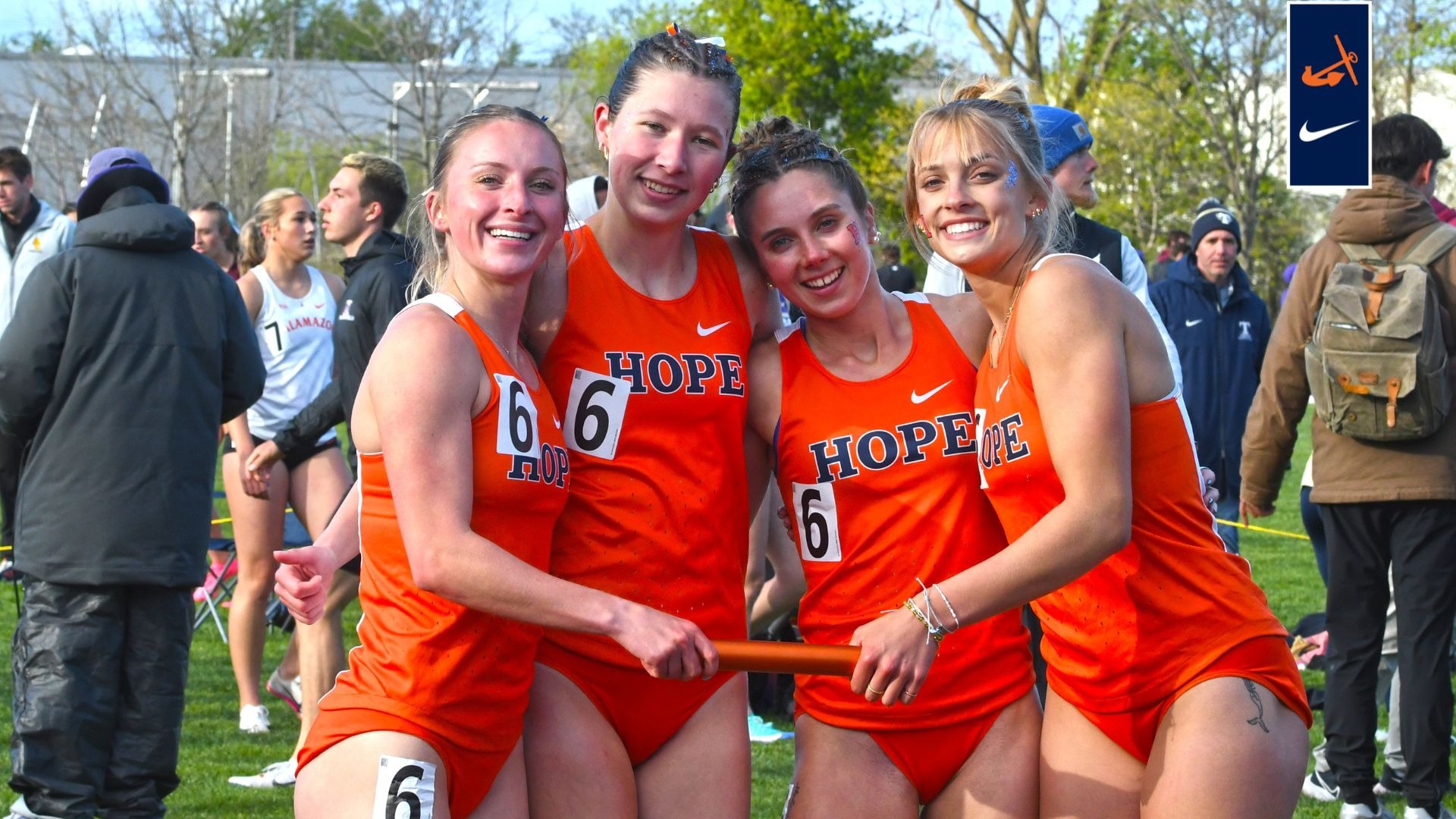 Four Hope women's 4x400 relay runners pose for portrait at Brewer Track.