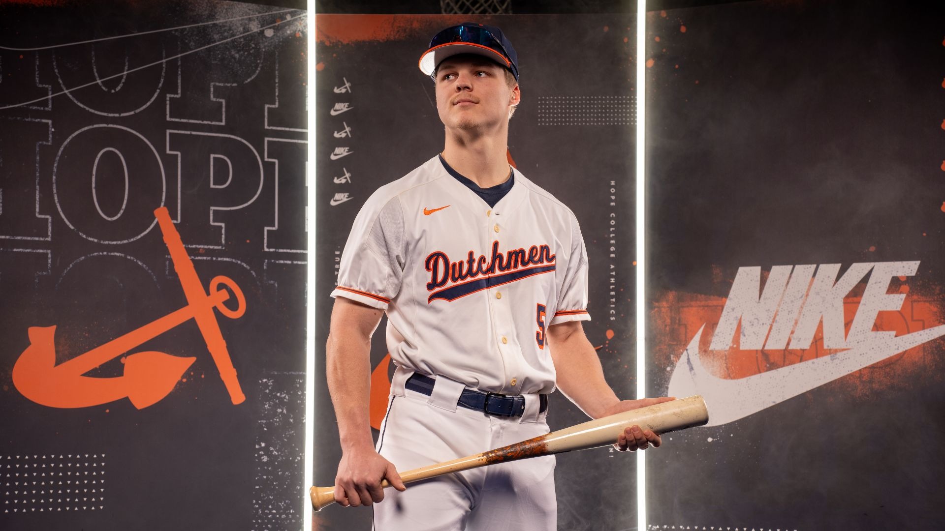 Jace DeMann holds a baseball bat.