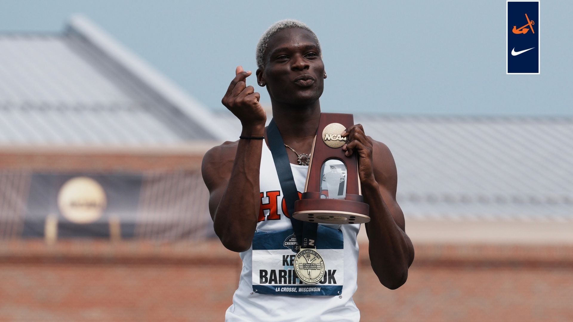 Kairo Barifagok holds his NCAA track trophy.