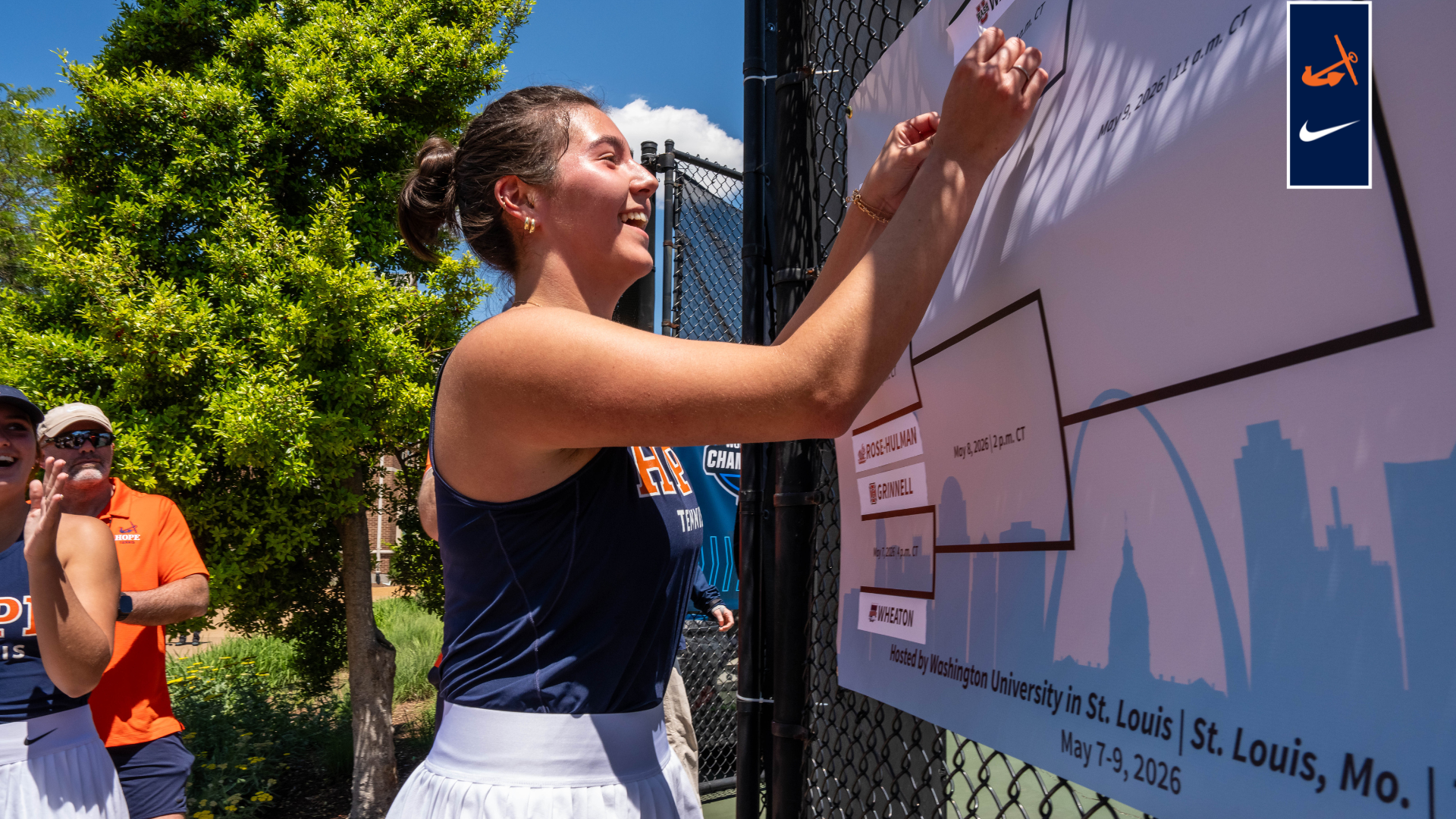 Jana Beier places sticker on poster 