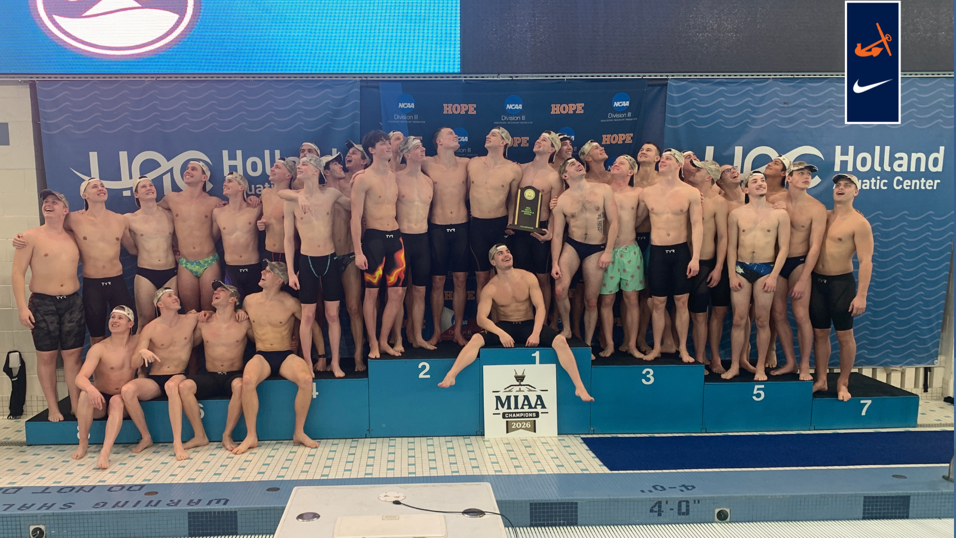 The men's swim and dive team poses for a portrait