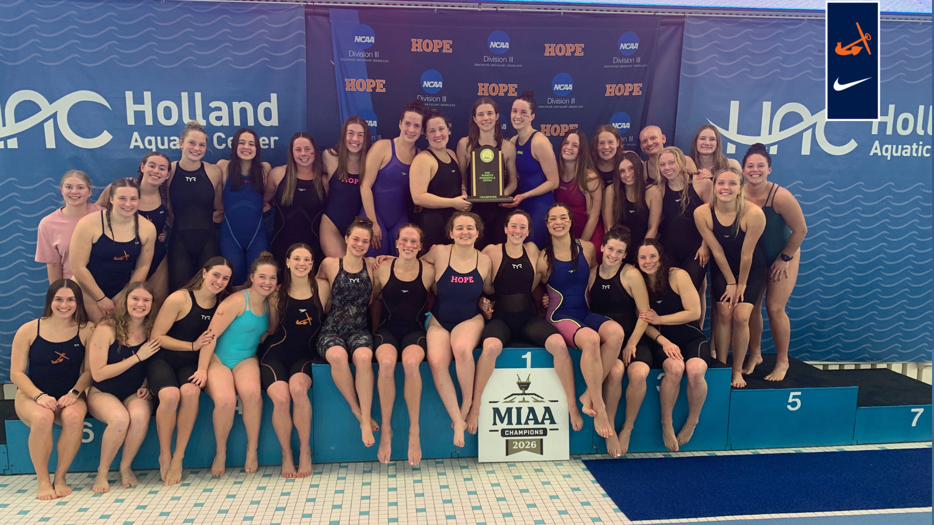 The women's swim and dive poses for a portrait