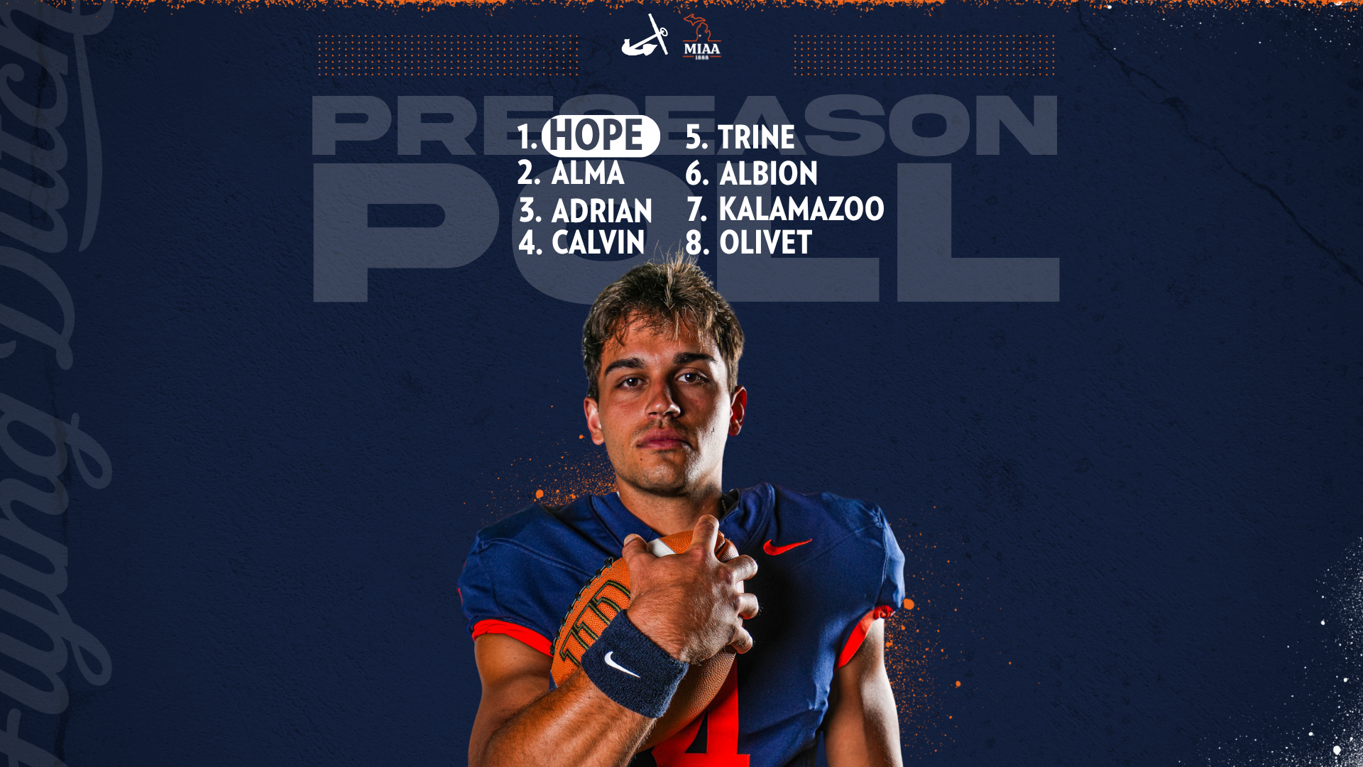 Alex Thole holds a football.
