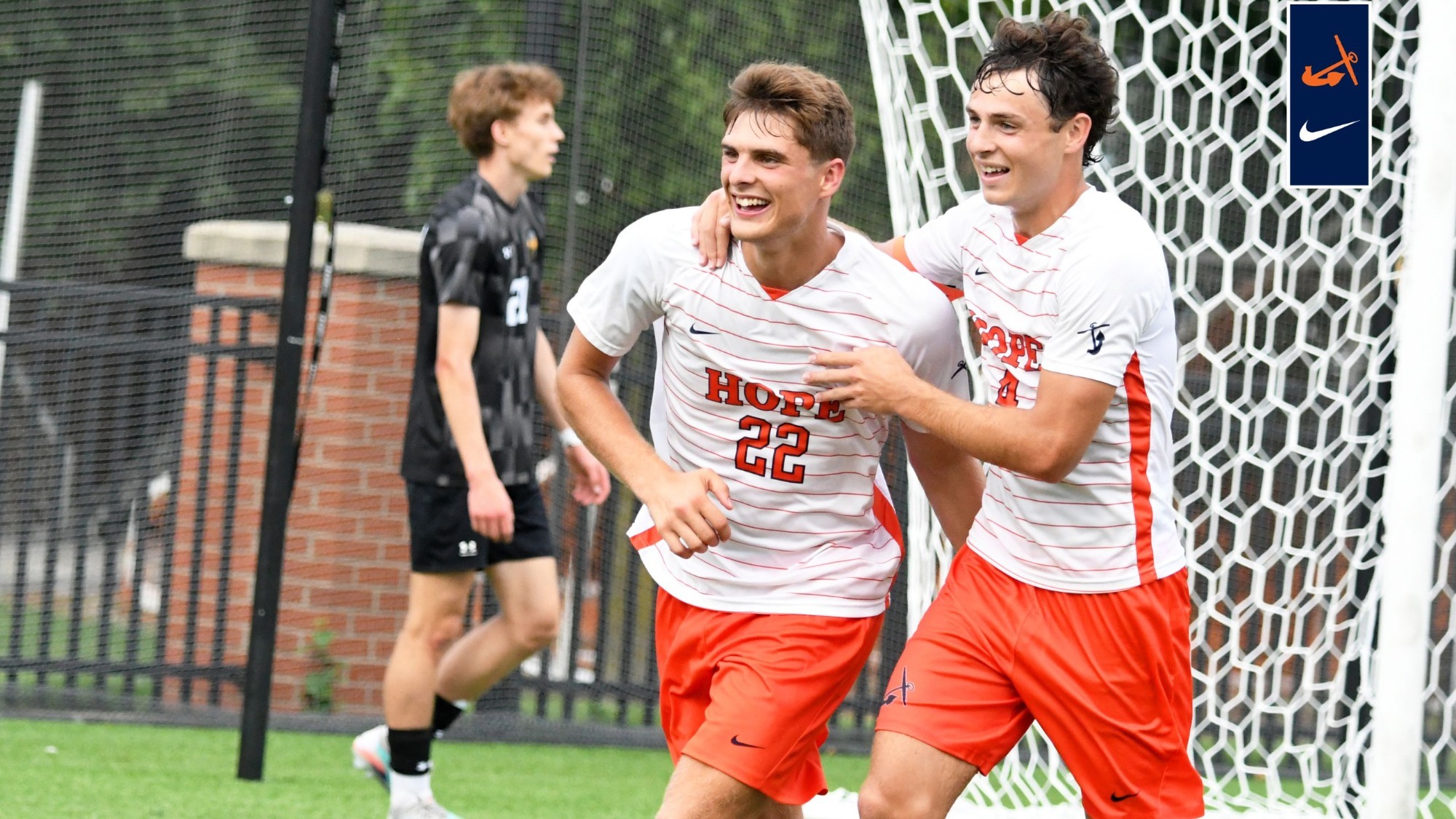 Caden Cheno and Seth Walters celebrate together after a goal.