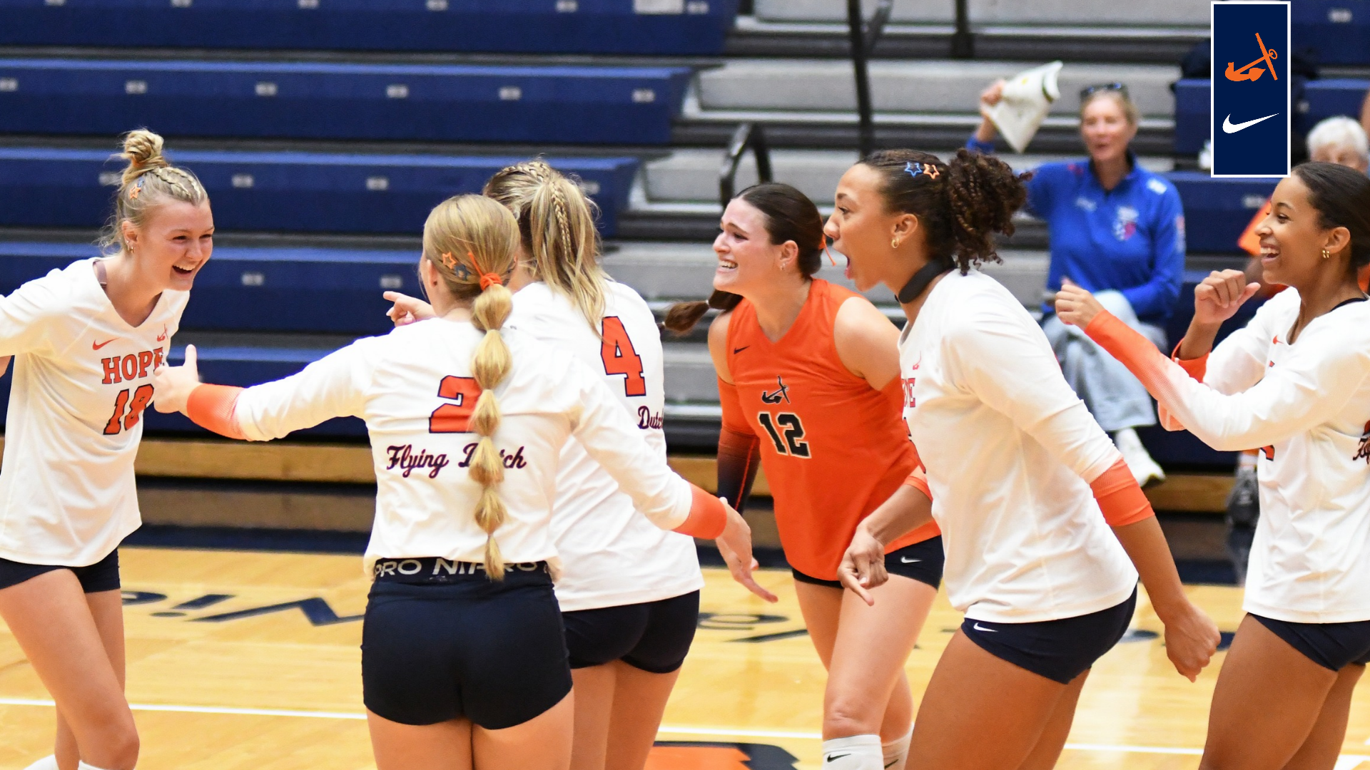 The Hope College volleyball team celebrates a point
