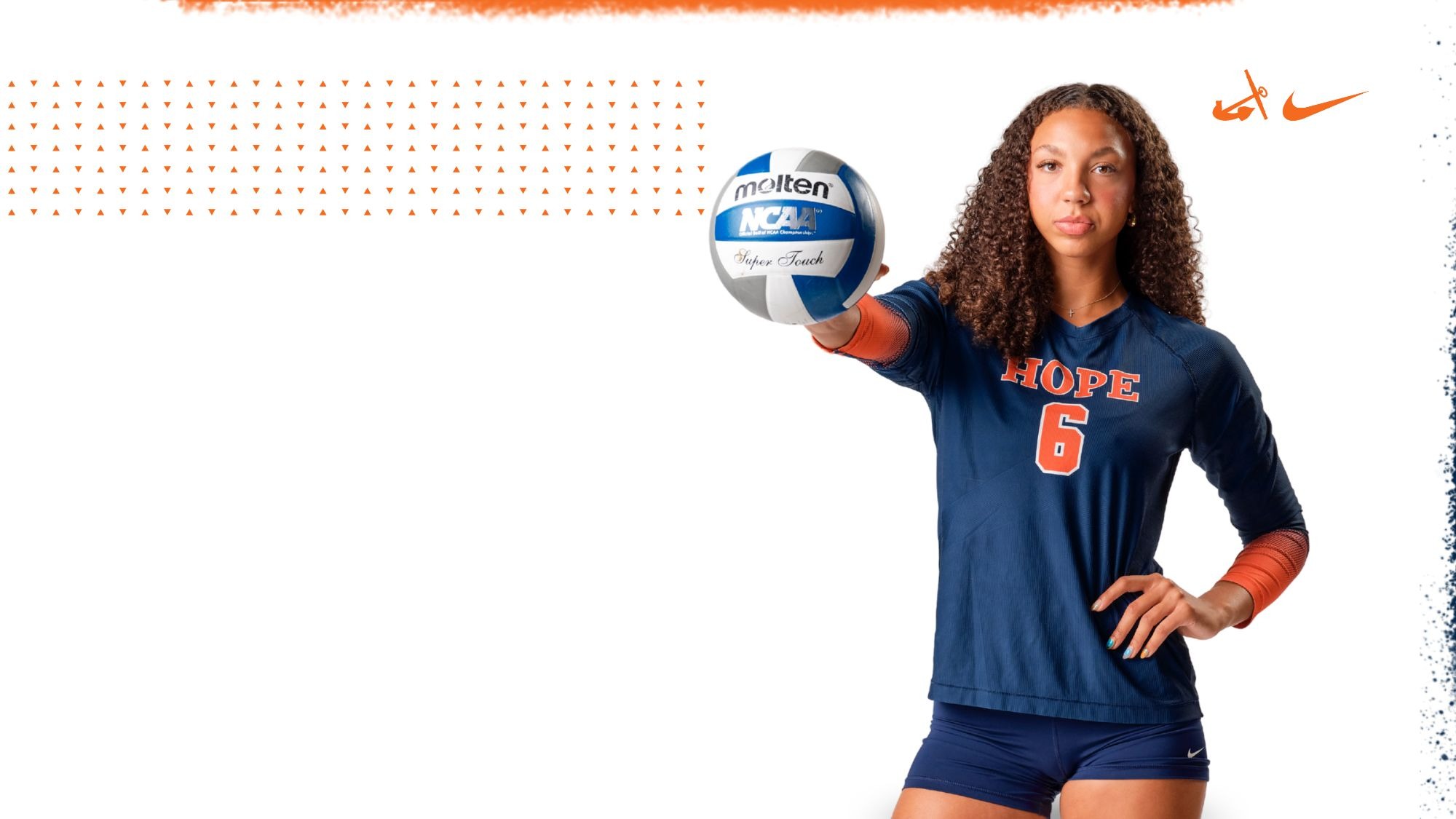Kamryn Burbridge holds a volleyball in front of her.