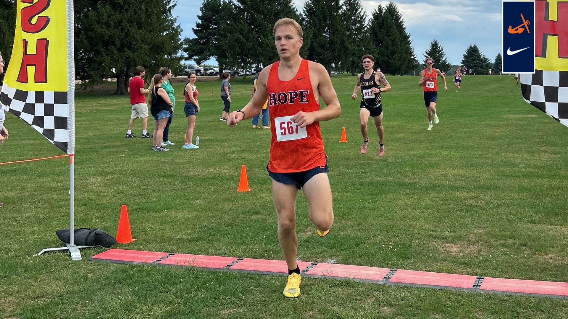 Andru Koehl crosses the finish line at Olivet