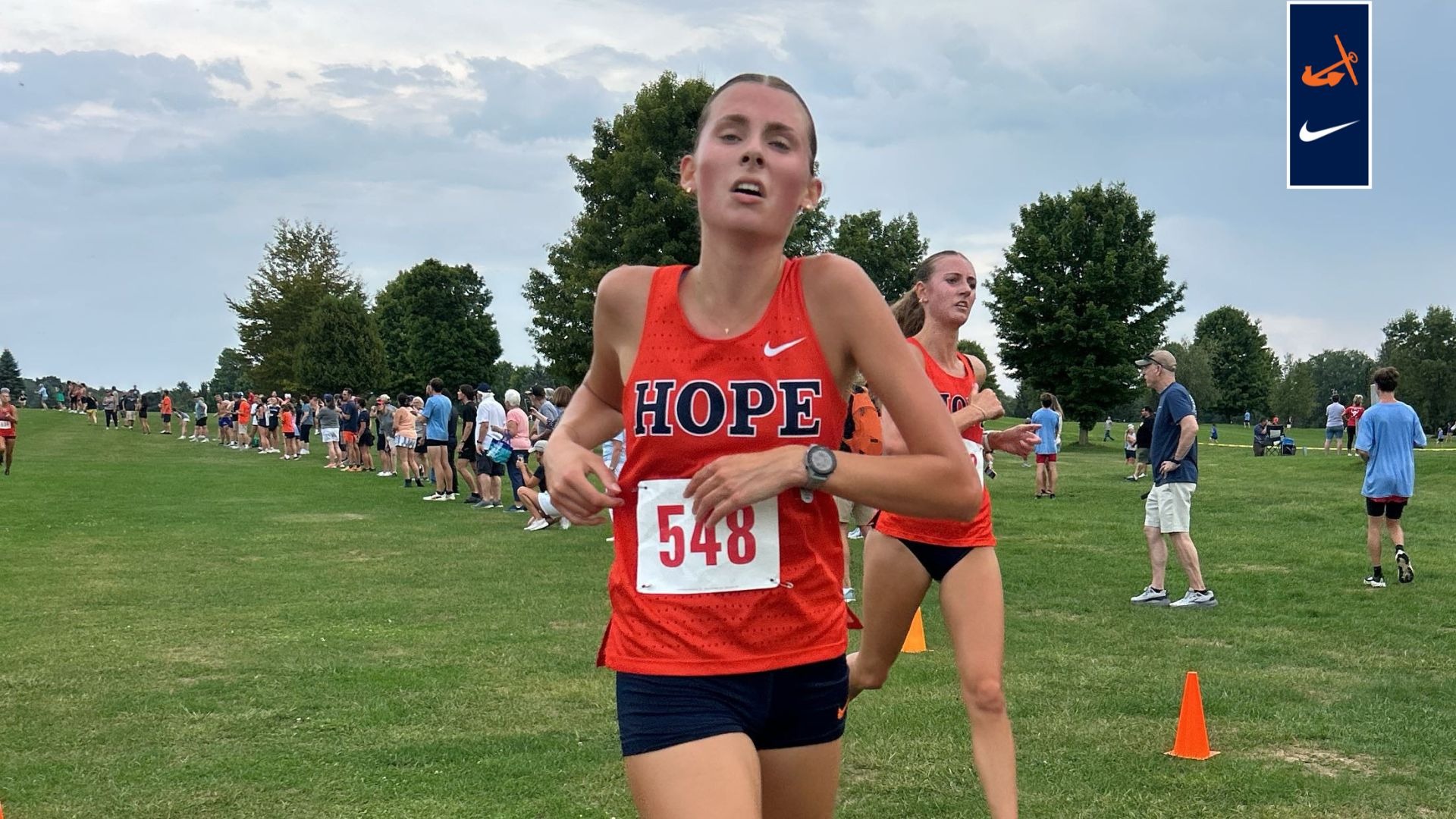 Ruth Miller crosses the finish line at Olivet.