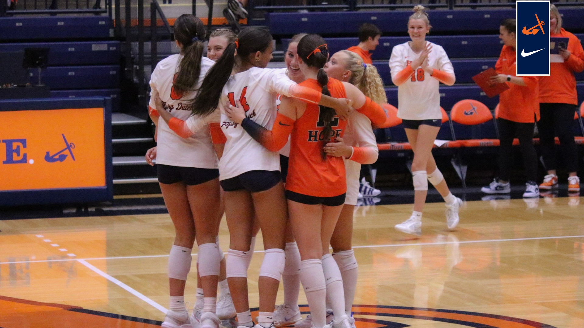 The Hope volleyball team celebrates a point