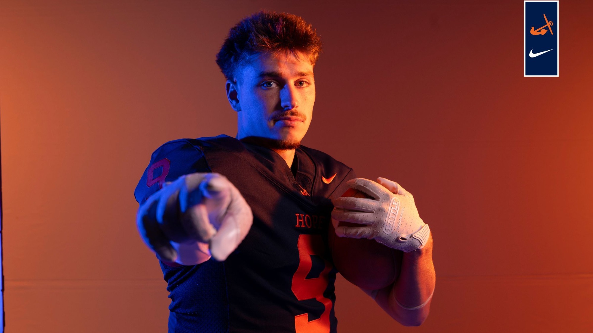 Tyson Mann holds a football.
