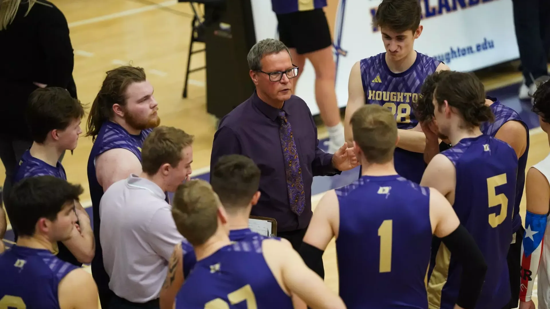 Men's volleyball team huddle