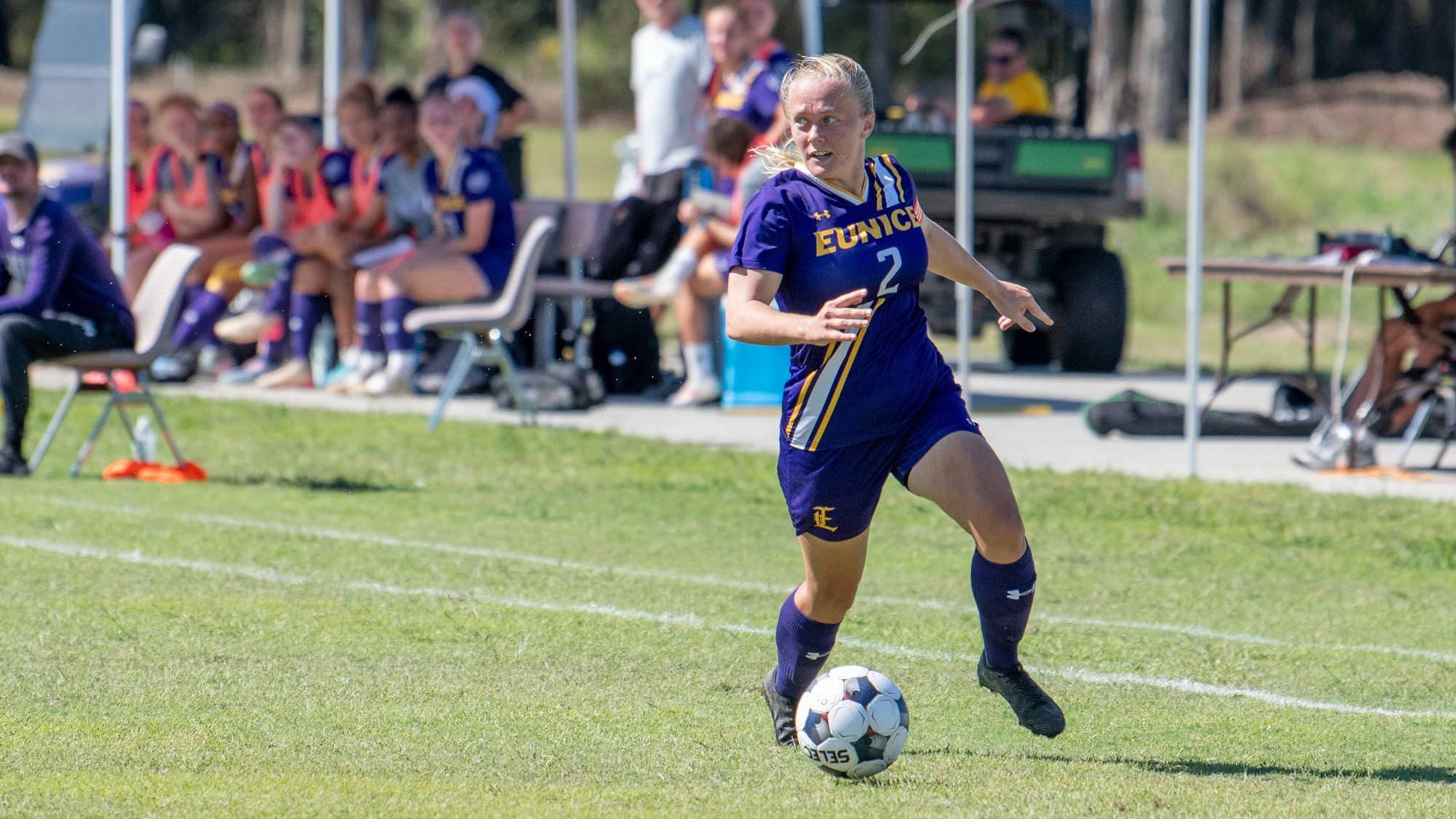 Luna Kullas advances the ball in action.