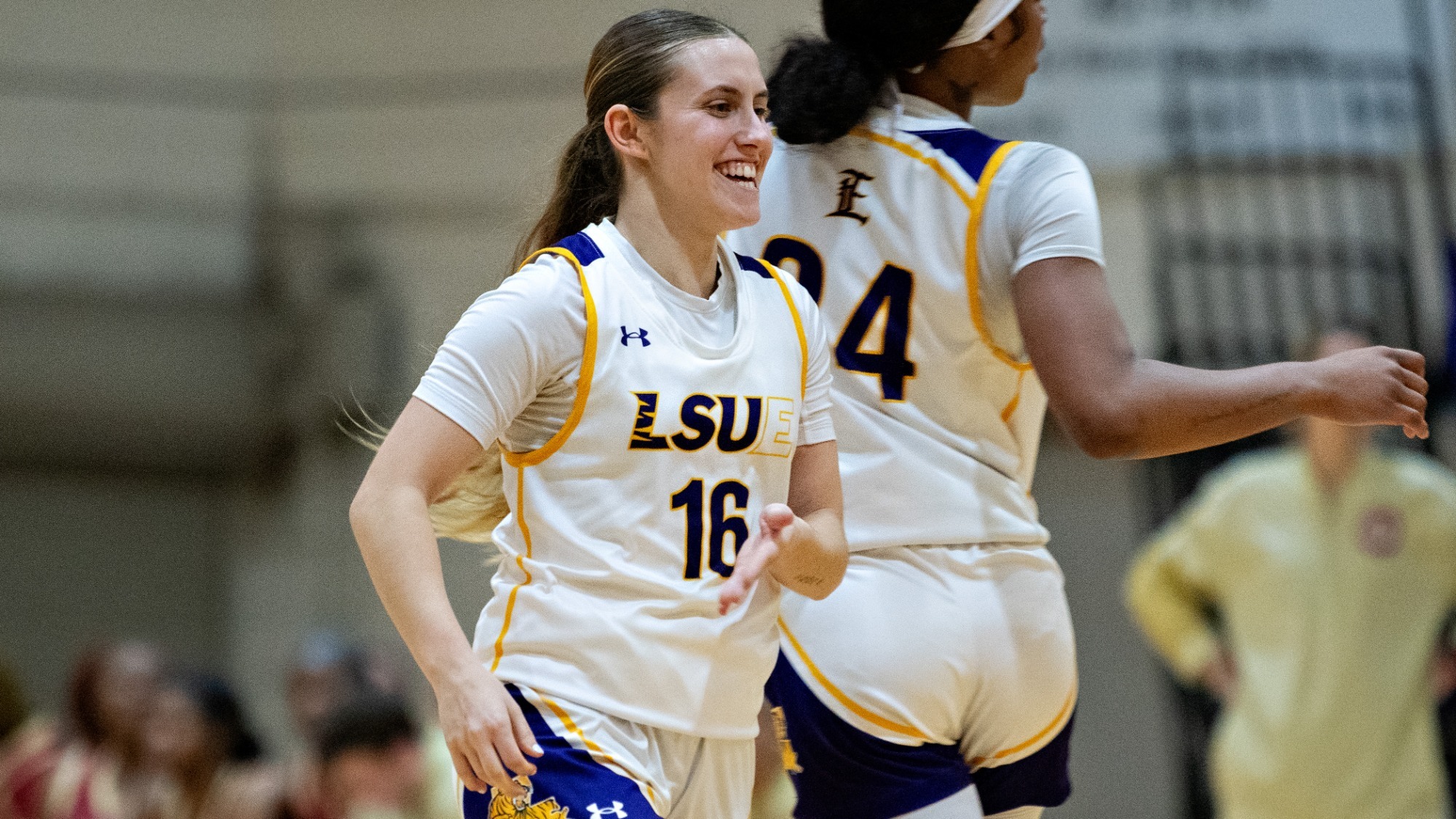 Edurne Diaz celebrates following a three-point basket.