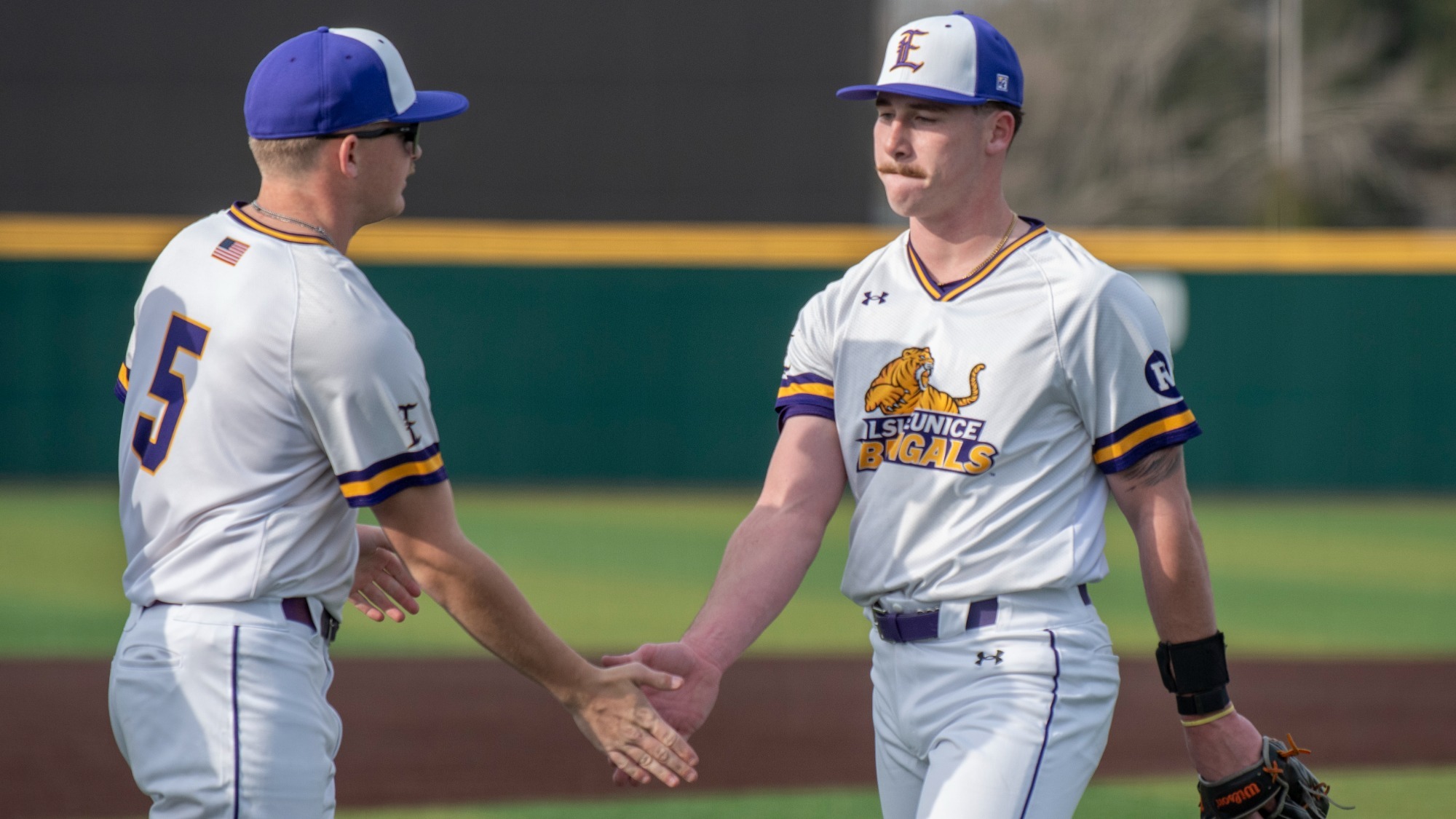 Beau Revord is congratulated by Hudson Spangler after getting out of an inning.