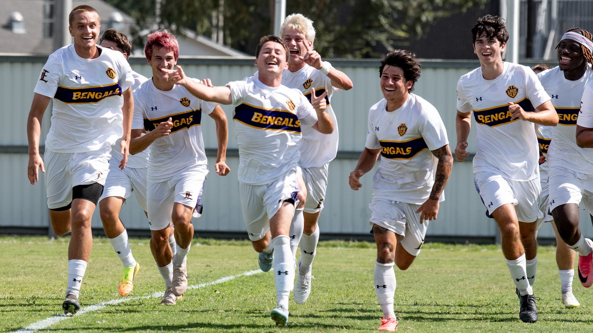Garrett Meaux leads a celebration on the field following his first career goal.