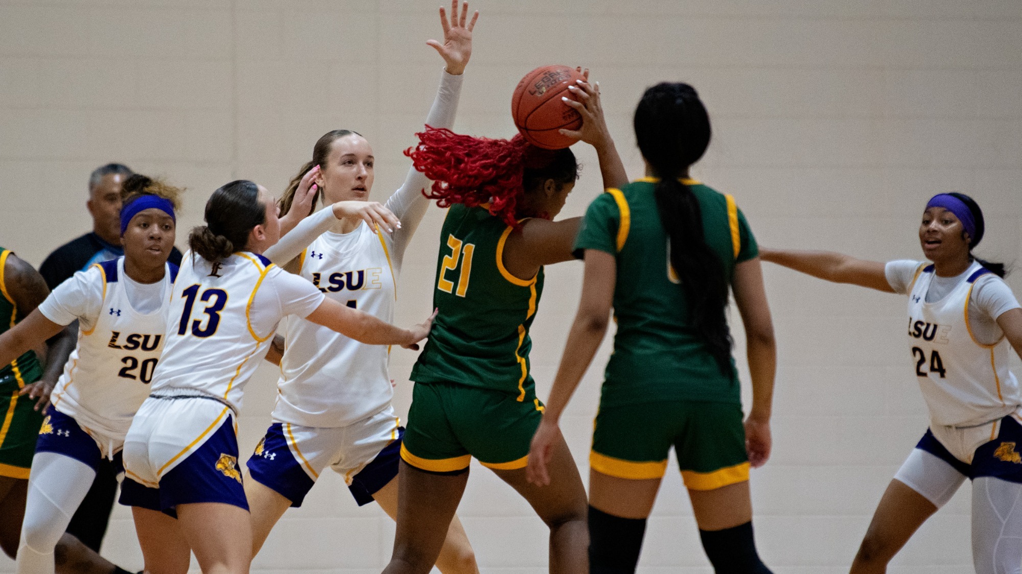 LSUE's defense makes a stop against Delgado in action earlier this season.