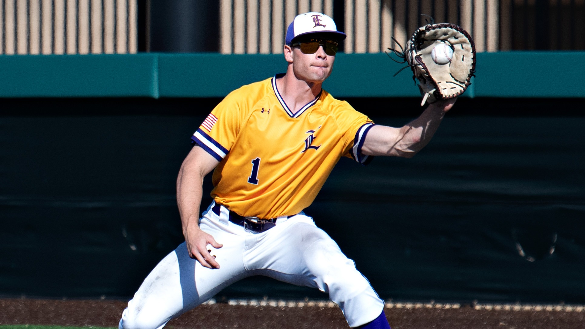 Aidan Mouton makes a catch at first base against National Park.