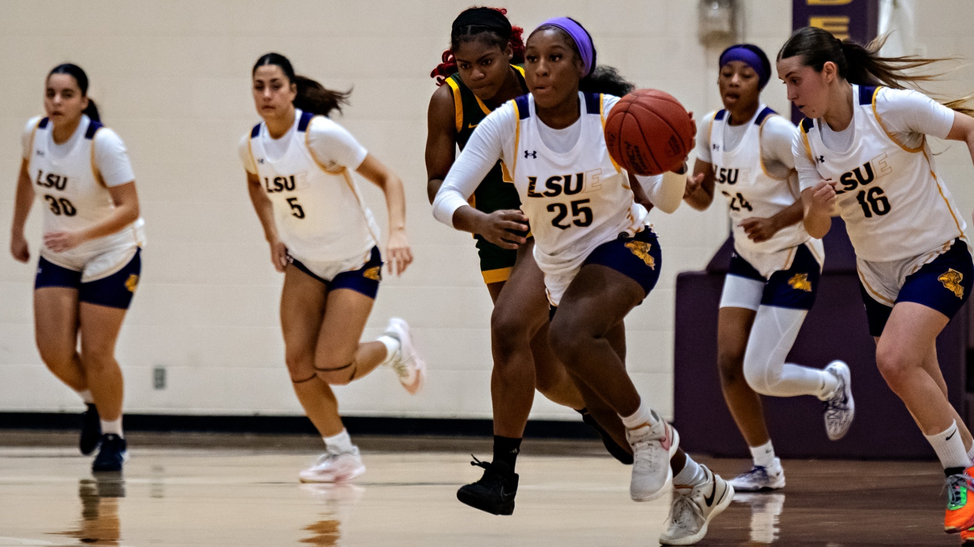 Kelsey Williams races into the front court against Delgado.