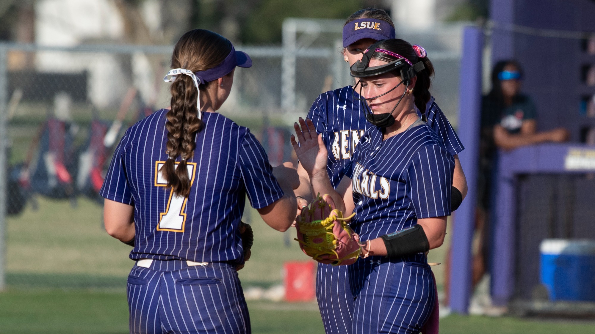 Anna-Cate Miller gets the ball before pitching in action at Lady Bengal Field.