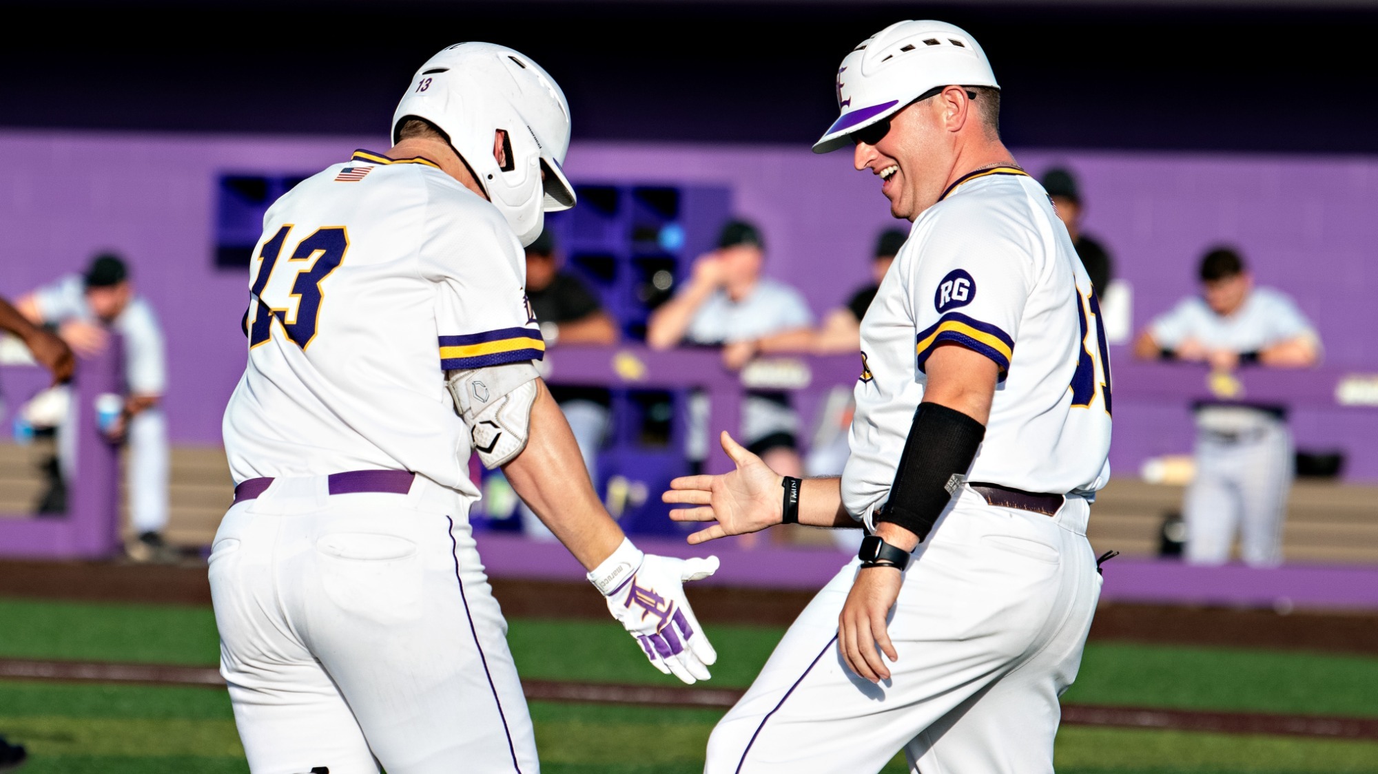 Caleb Hastings celebrates with coach Nick Studdard following a home run.