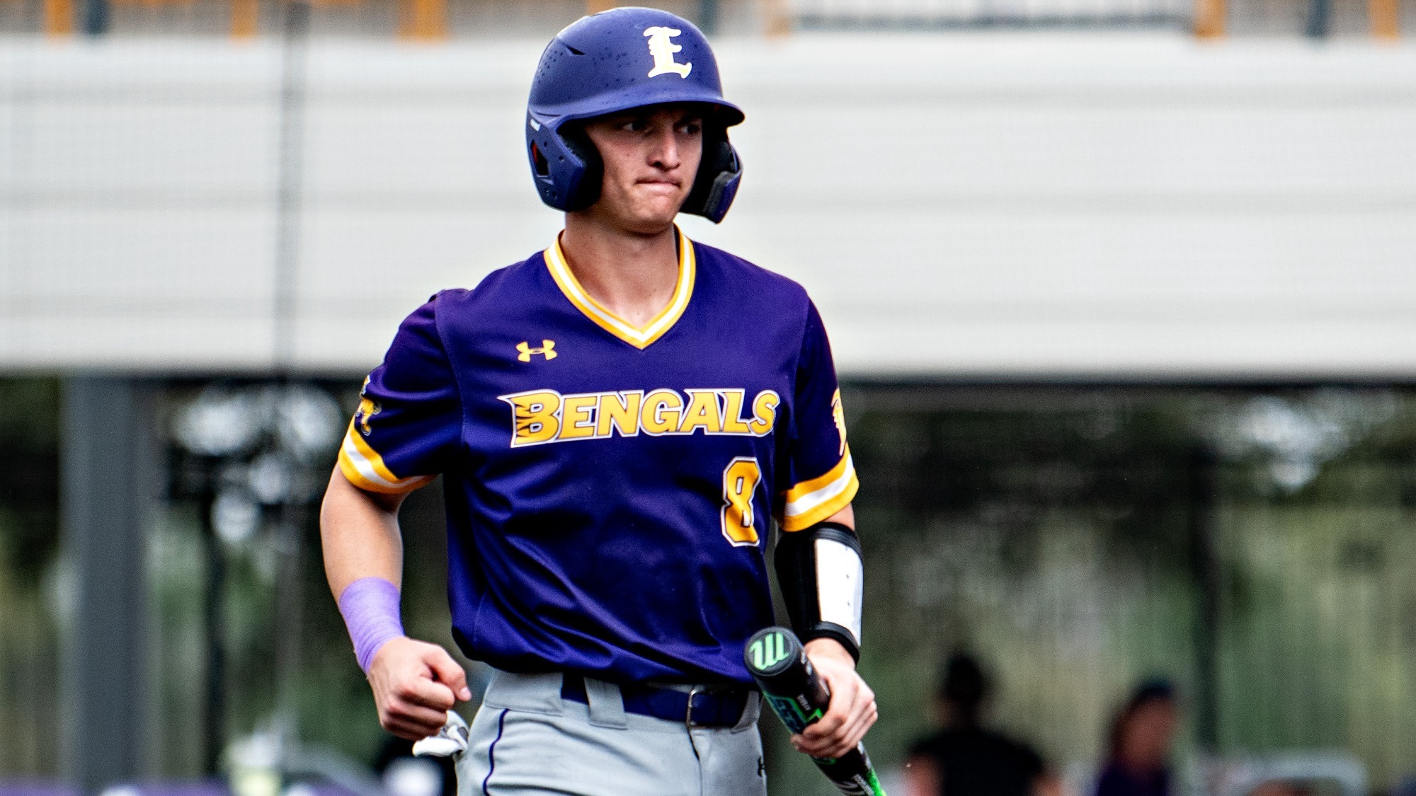 Milo Obradovich comes back to the dugout after scoring in a game at Bengal Stadium.
