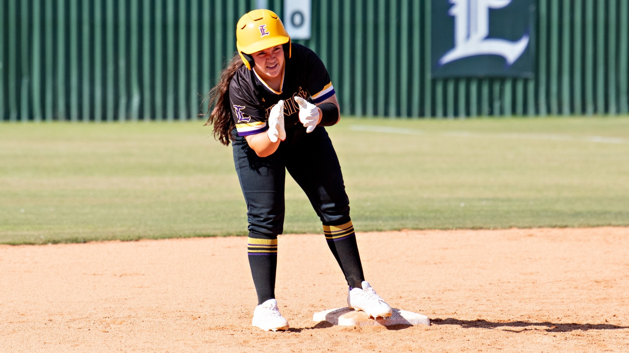 Jadyn Yesso encourages her teammates after hitting a double in action this season.