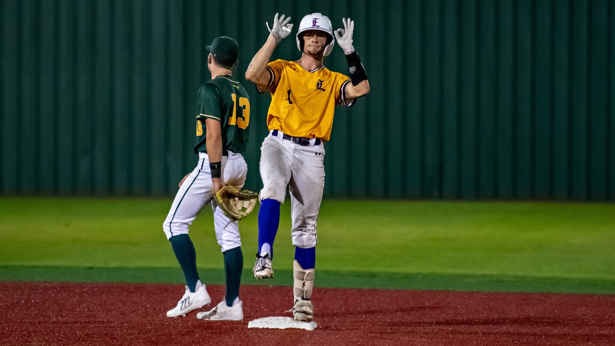 Aidan Mouton celebrates a two-run double in action vs. Delgado.