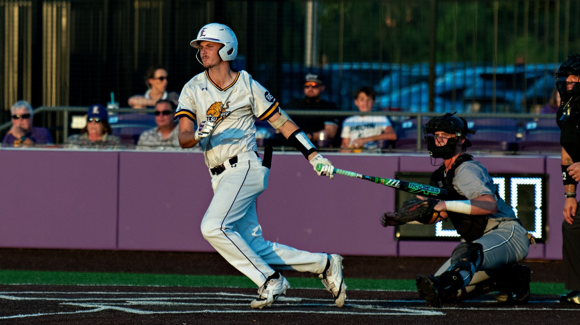 Marshall Louque hits a double during the South District Series.