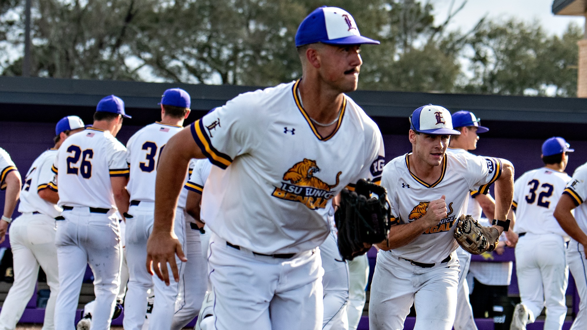 Mason Bordelon jogs onto the field to begin a game at Bengal Stadium.